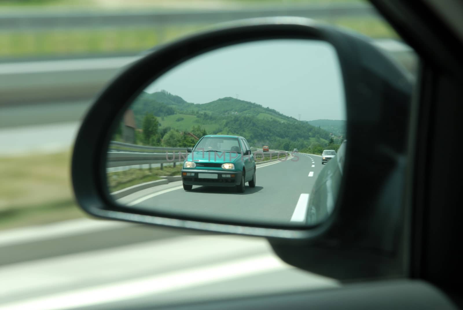 rear view refflection on the car mirror