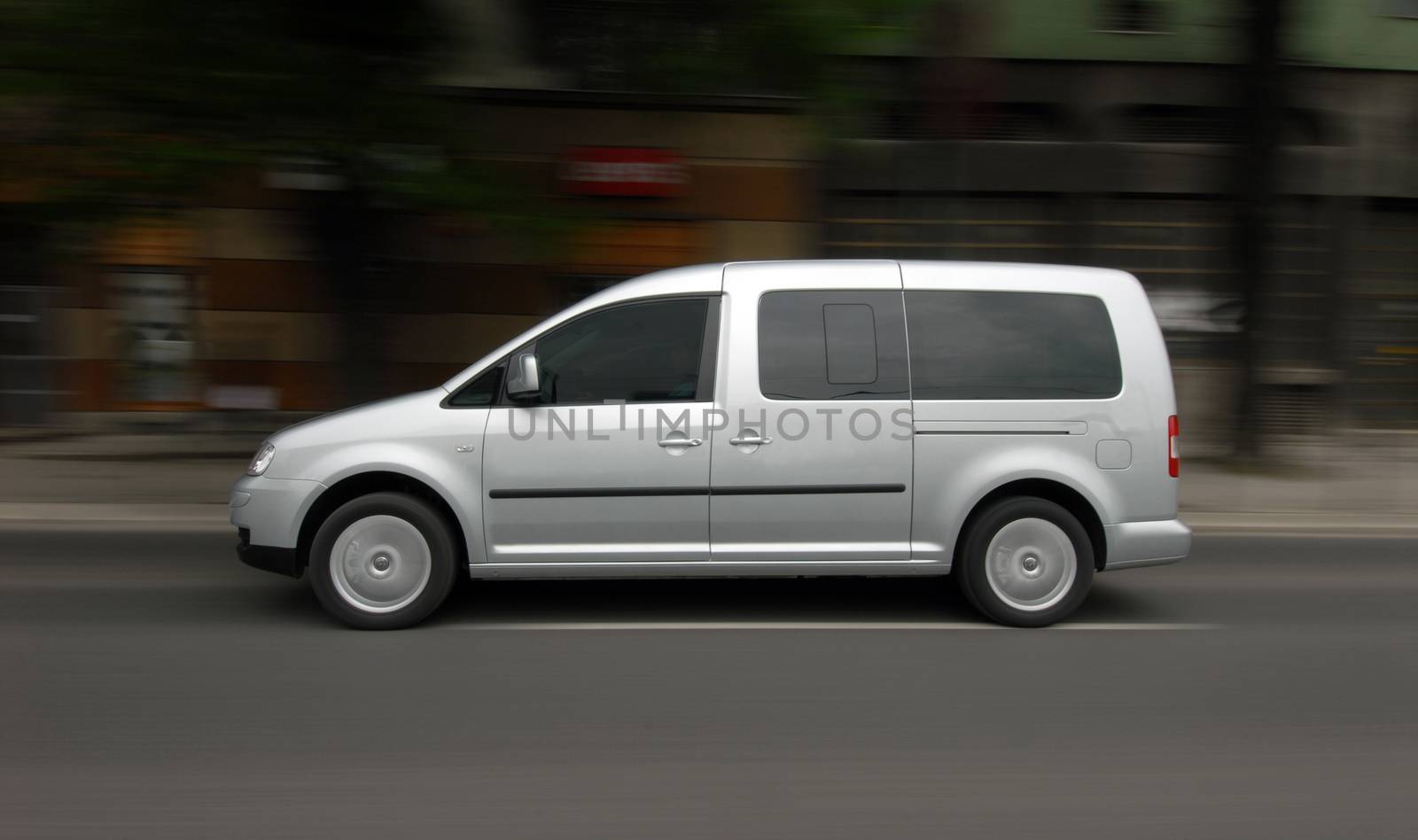 Fast moving white van on the road