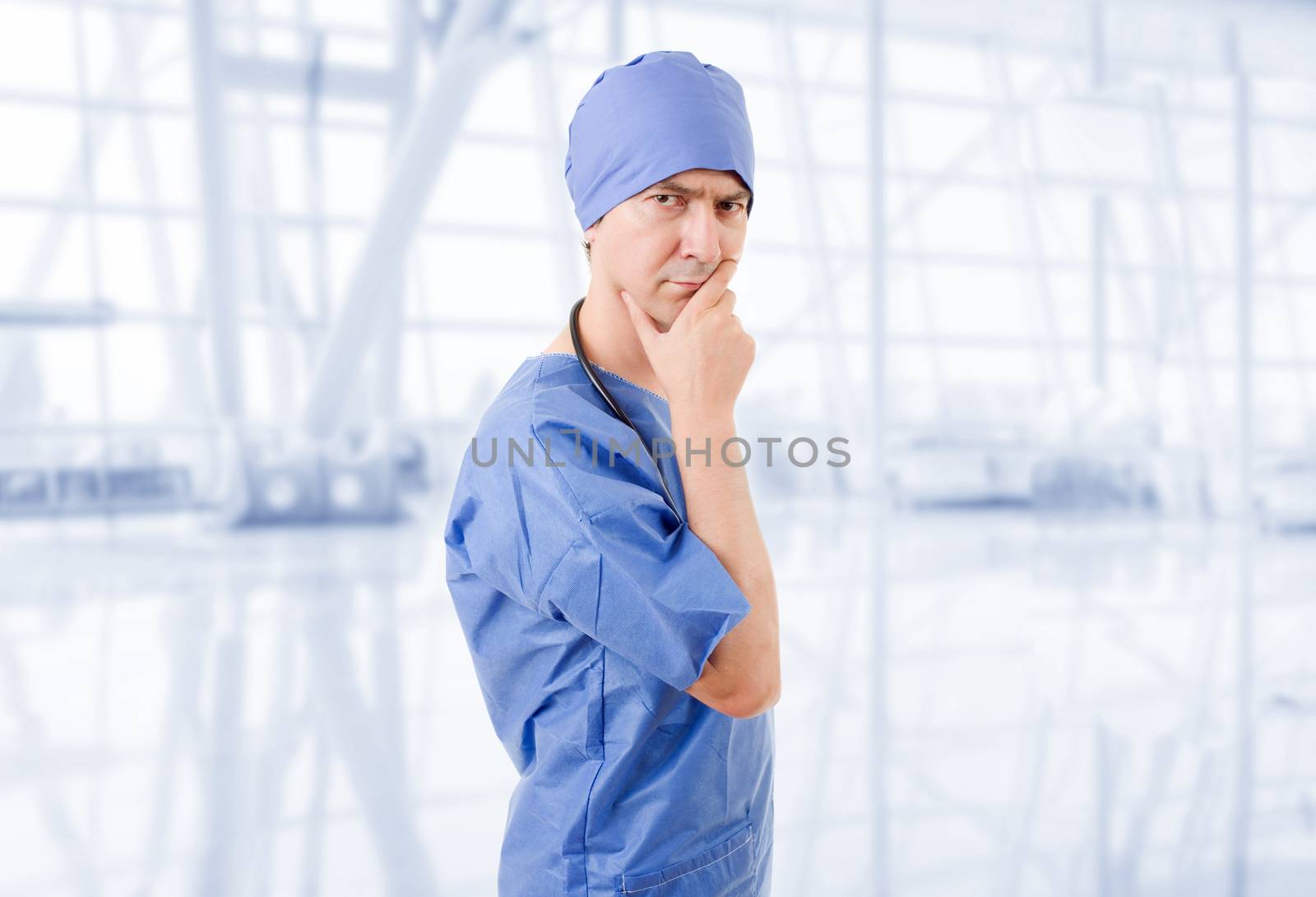 male doctor thinking at the hospital, worried