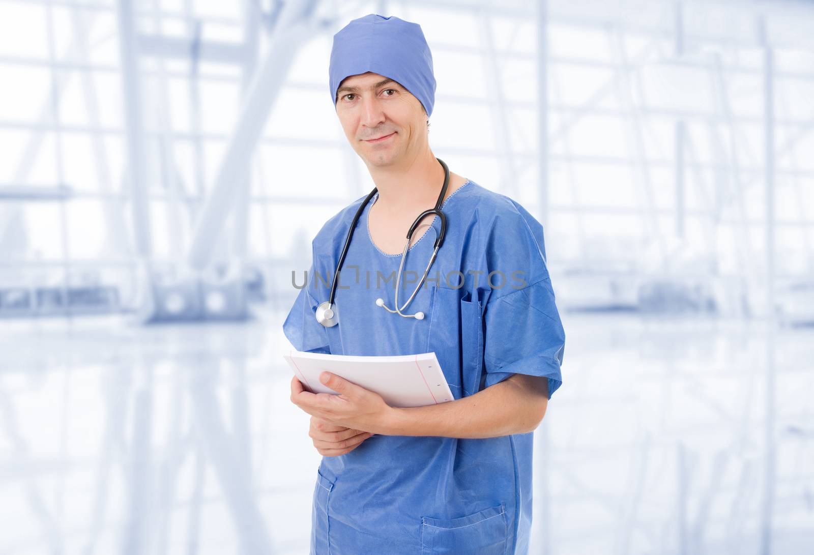 happy doctor with his notes at the hospital