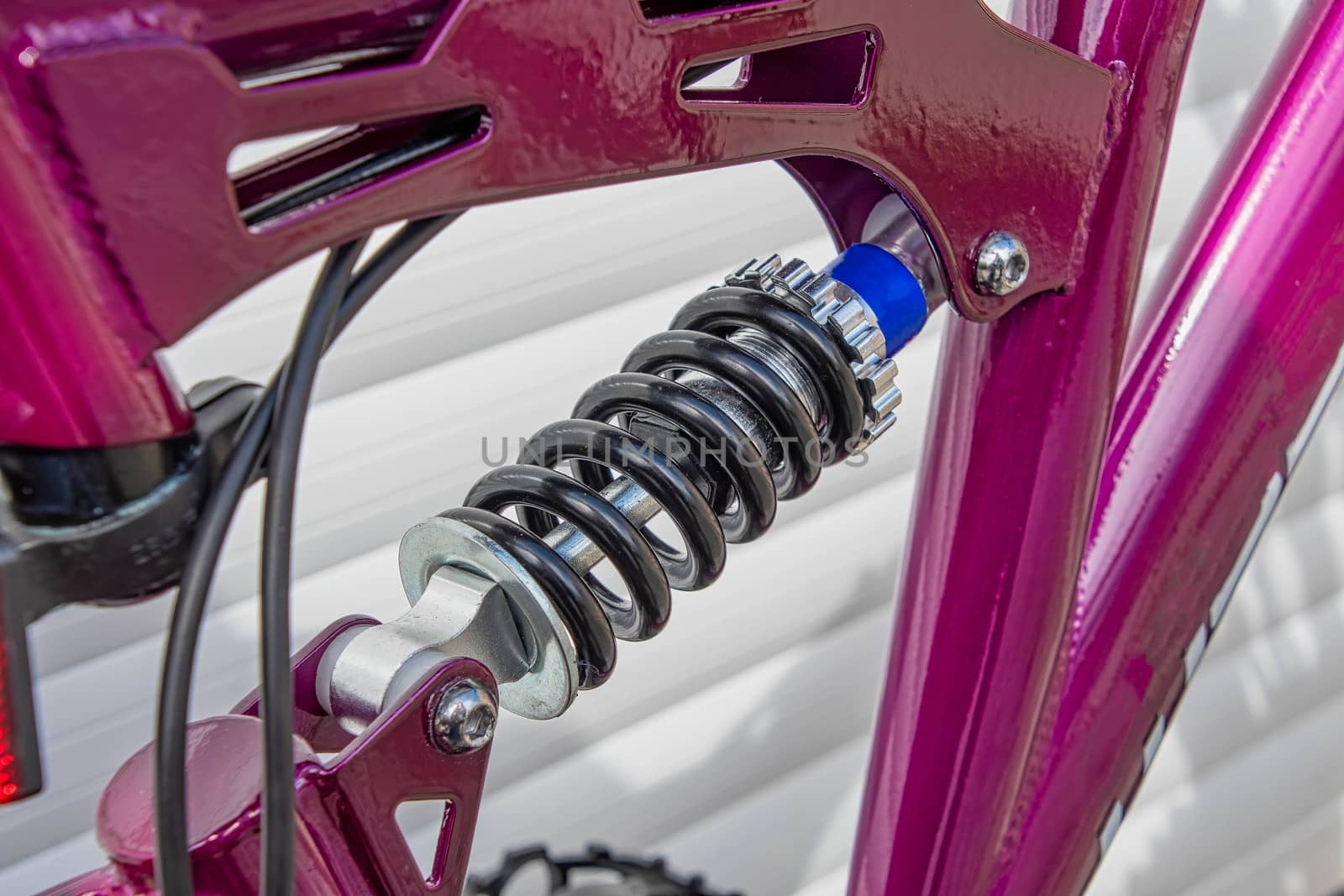 A close view of a bicycle rear suspension spring