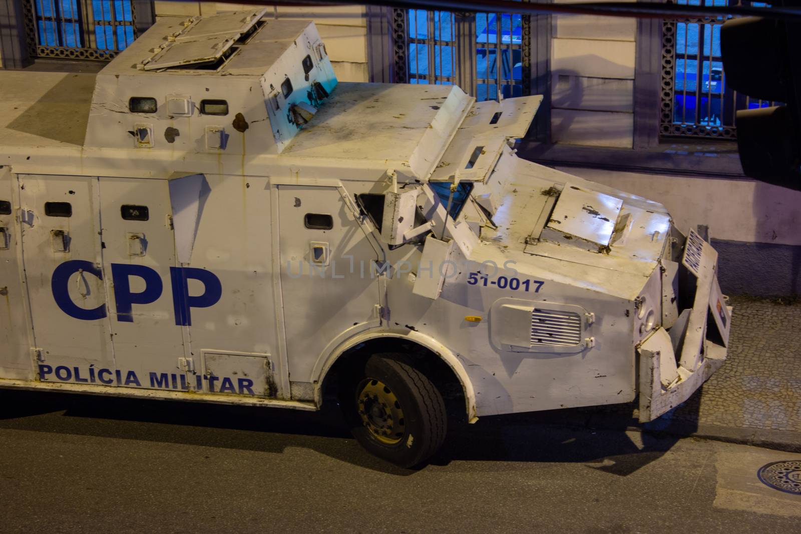 Police armored truck parked in front of a police station by etcho