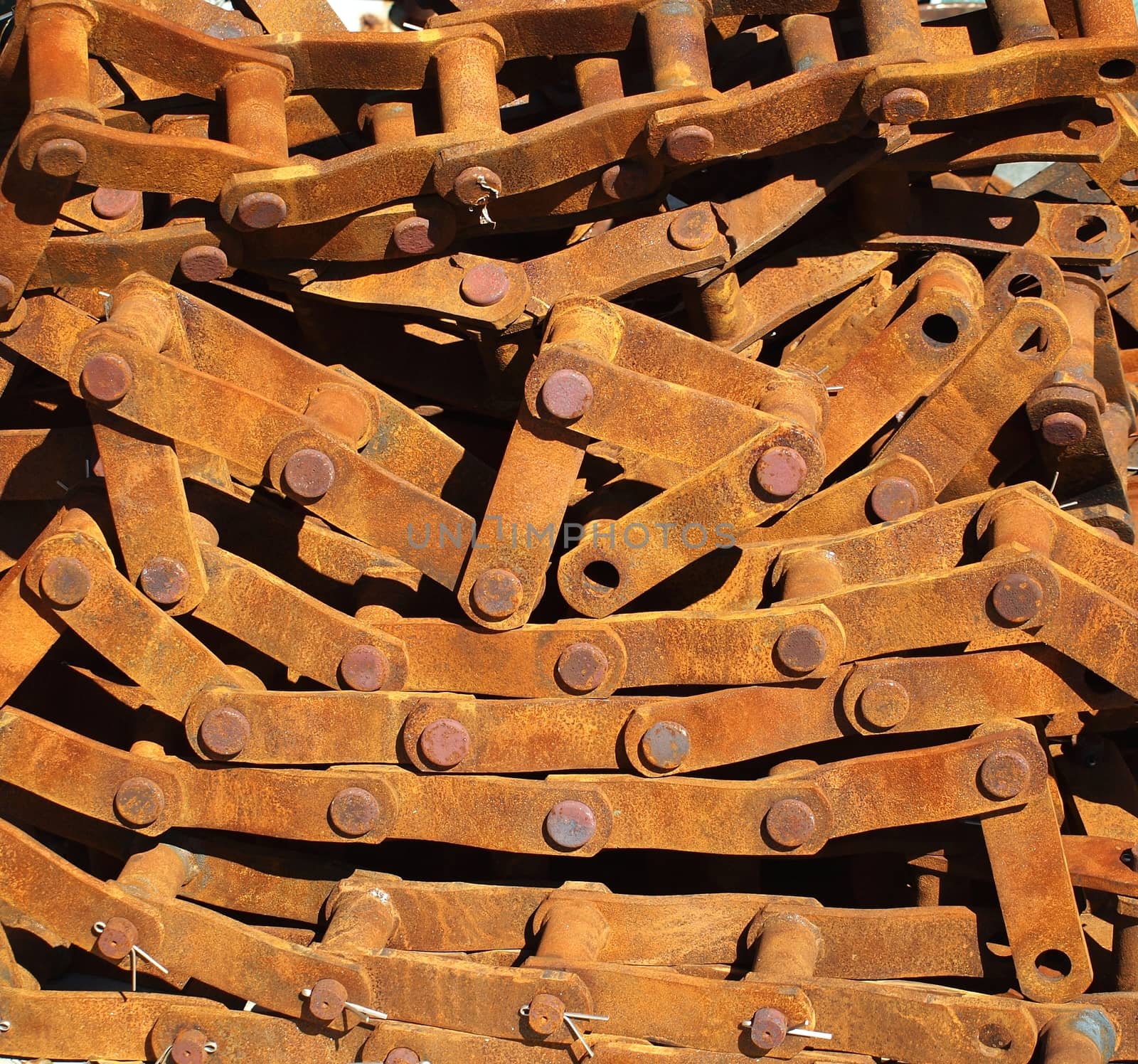 A rusty old chain link system that was part of a continuous track
