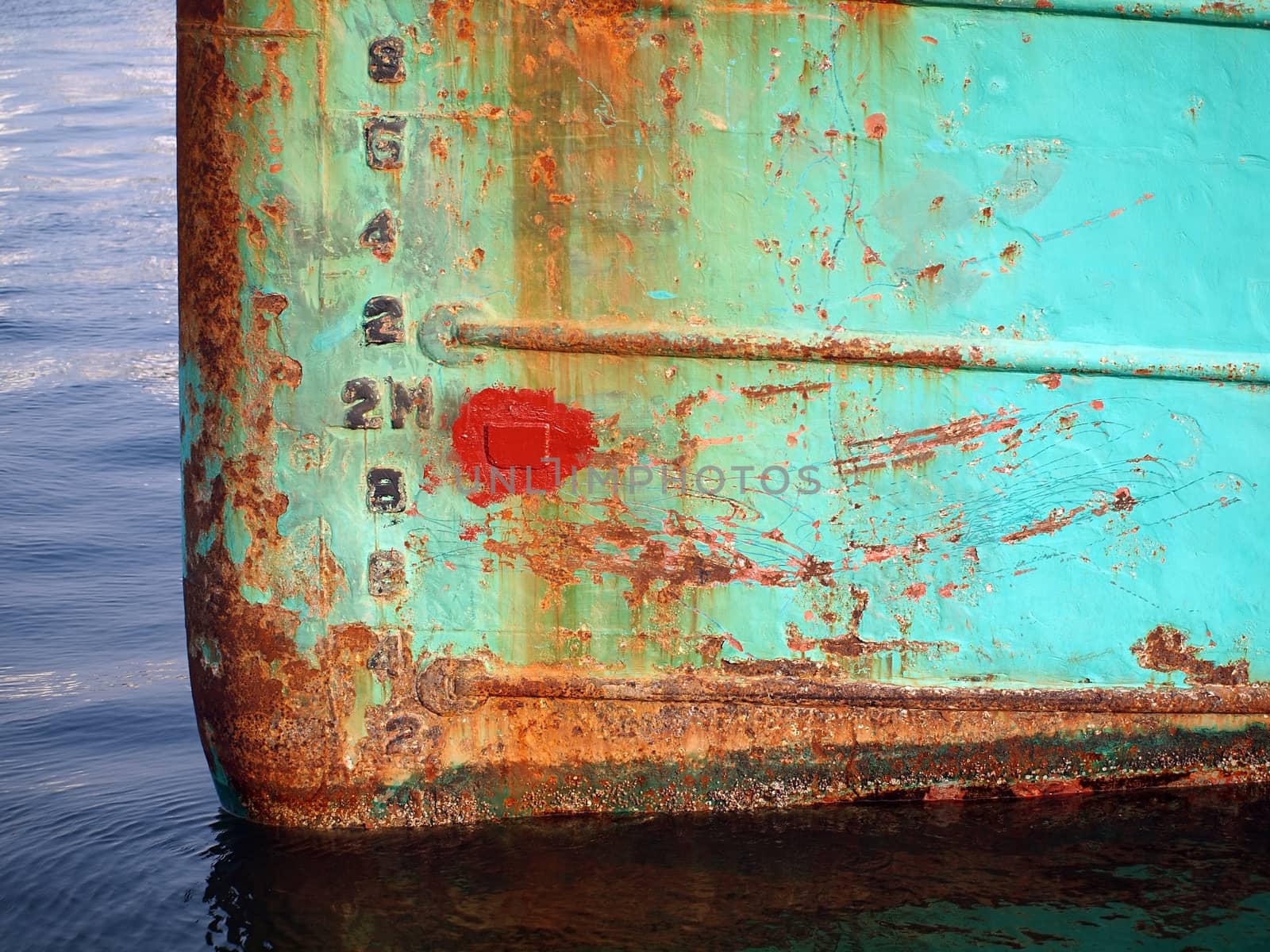 The bow of a ship showing heavy corrosion
