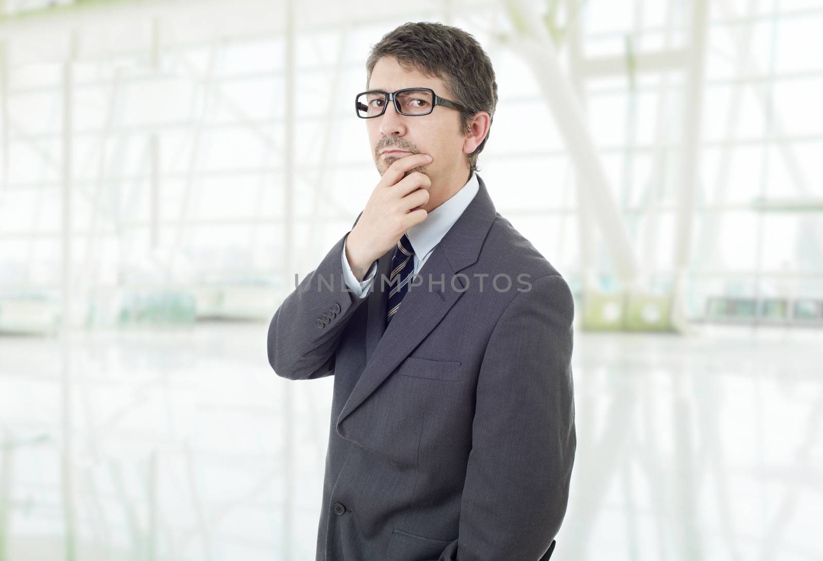 young business man thinking, at the office