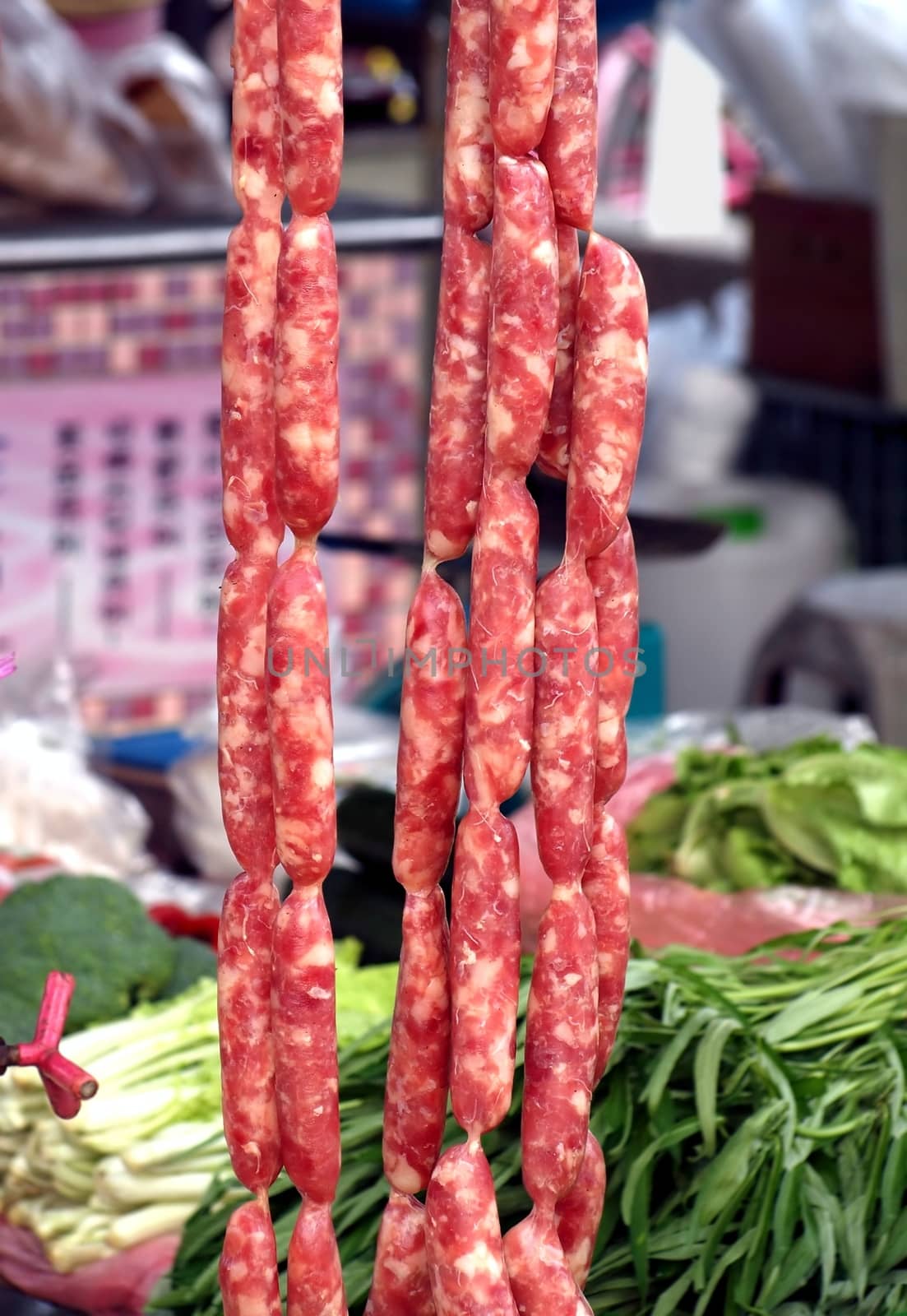 Handmade sausages for sale at a local outdoor market
