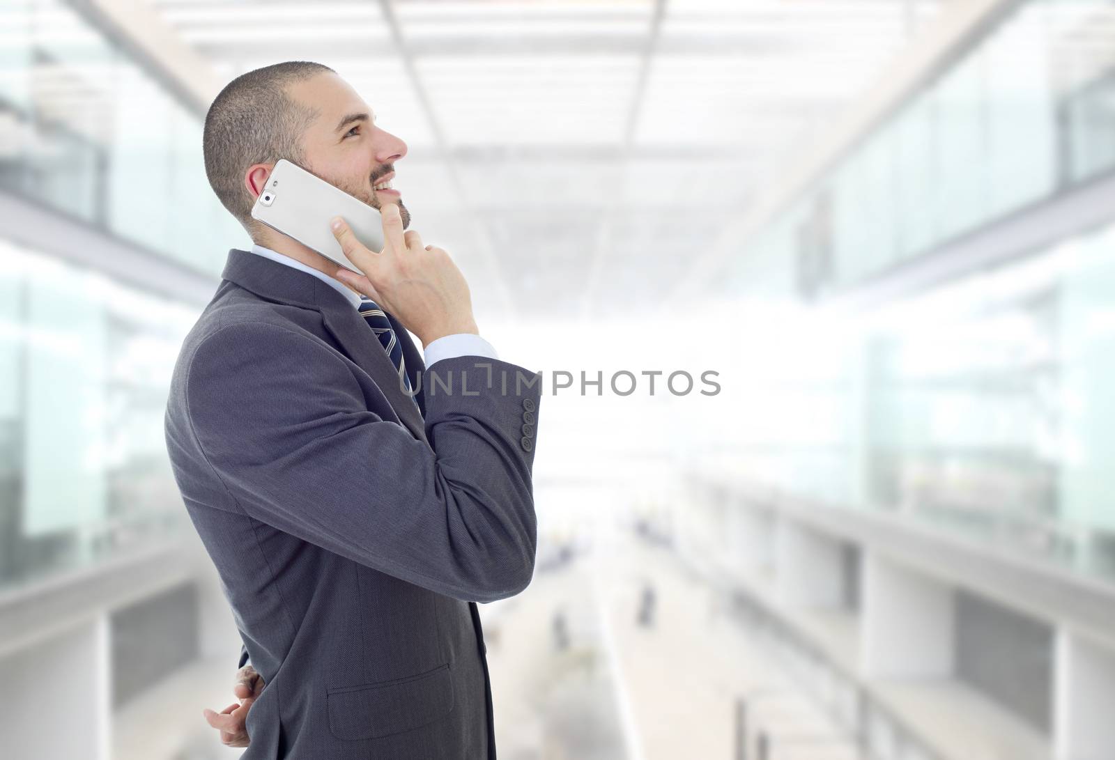 happy business man on the phone, at the office