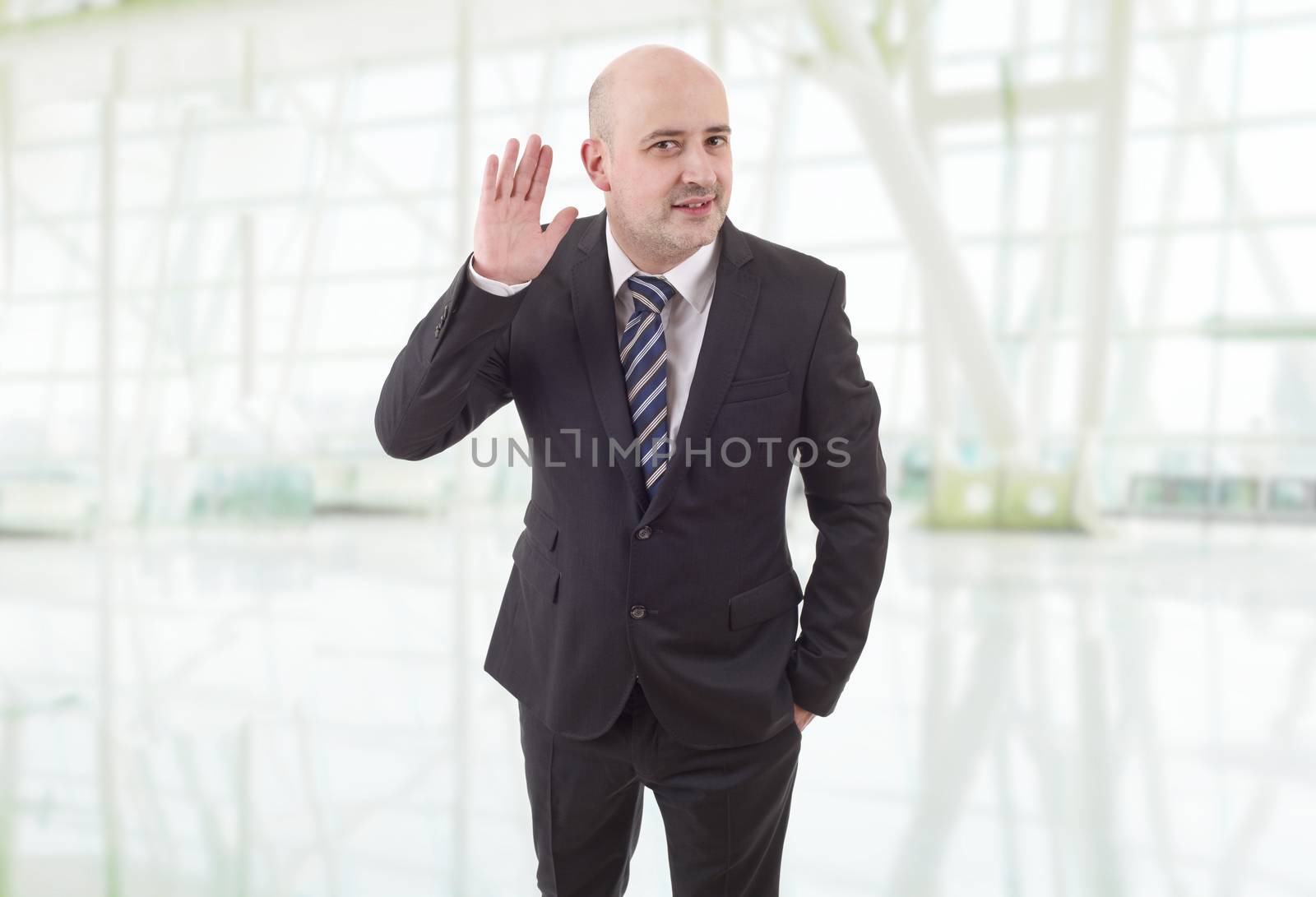 happy business man listening at the office