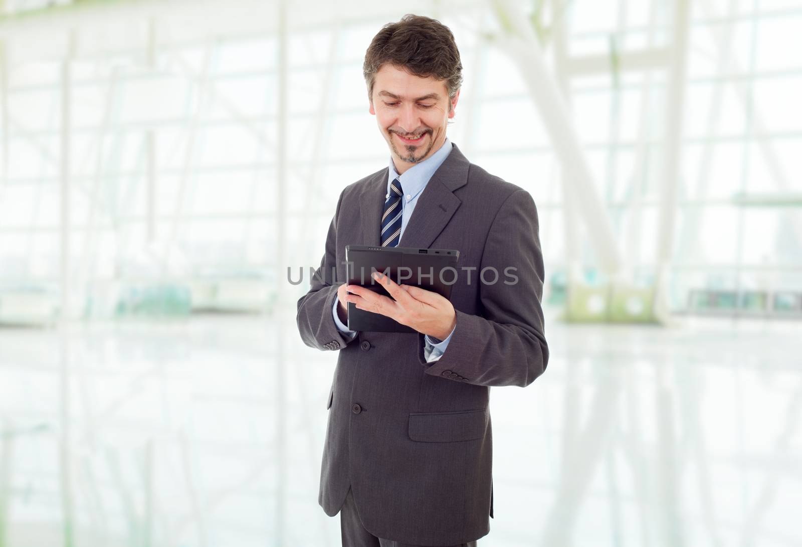 young businessman with a tablet pc, at the office