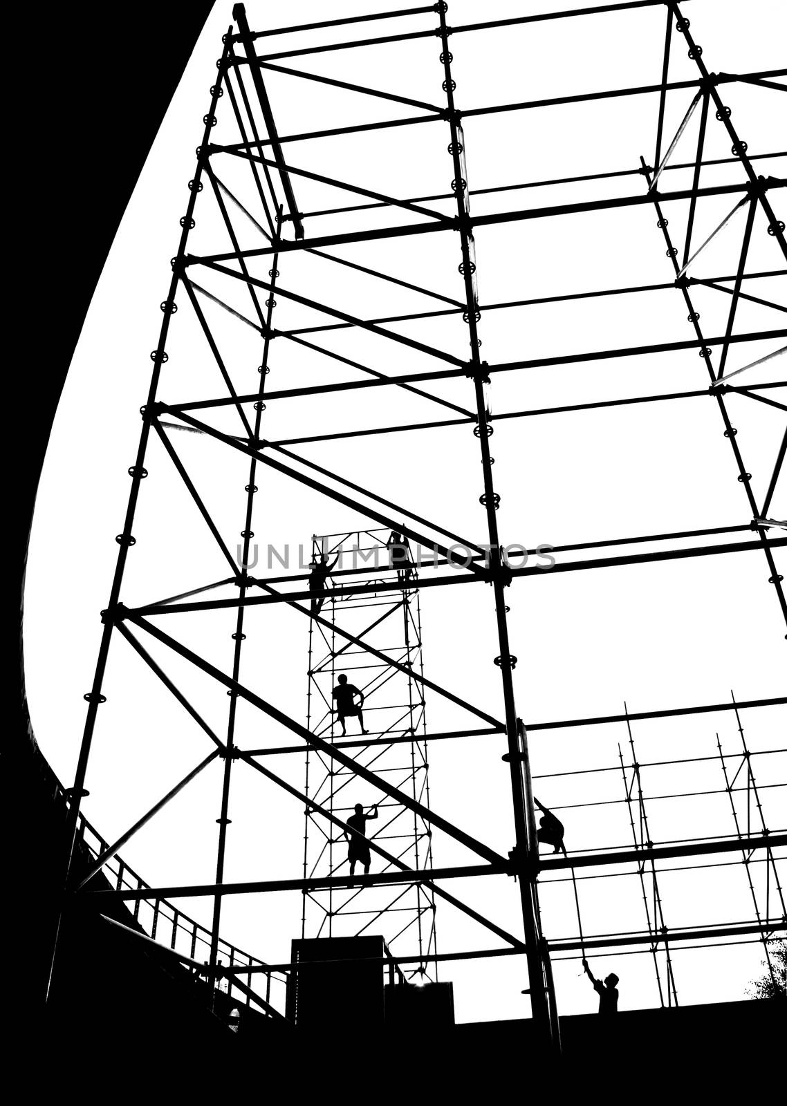 Construction workers in silhouette on a stage setup