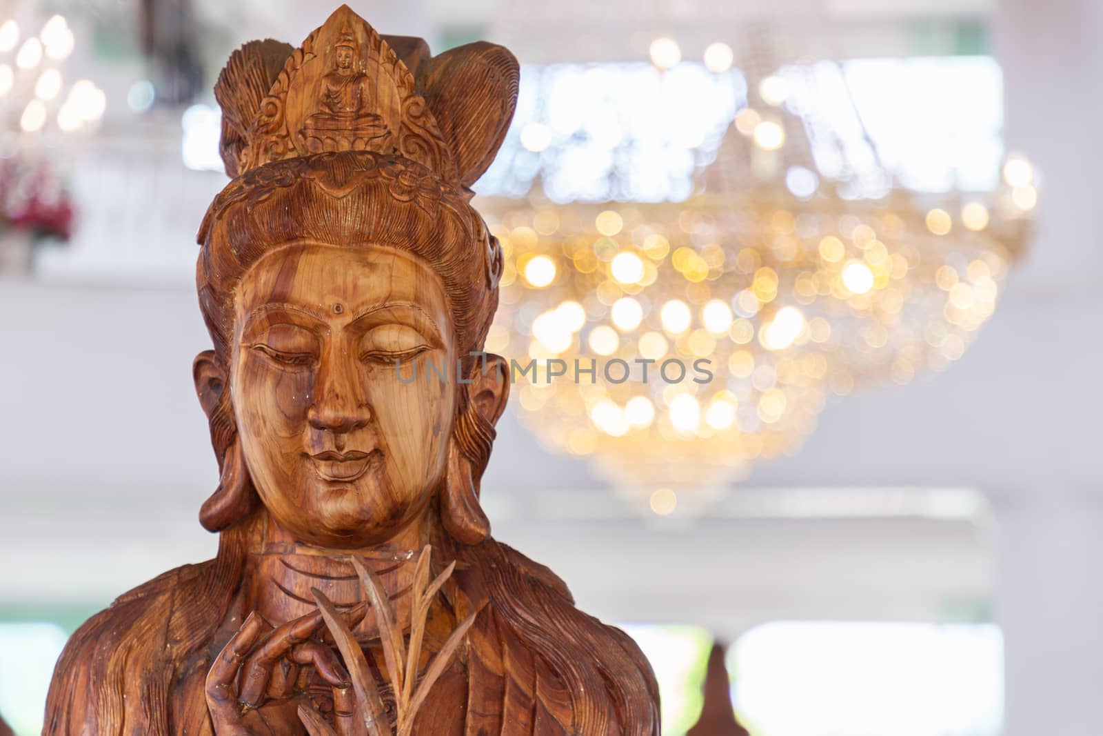 Beautiful wood statue of Guan Yin at Huay Pla Kang Temple, Chiang Rai, Thailand. by phanthit