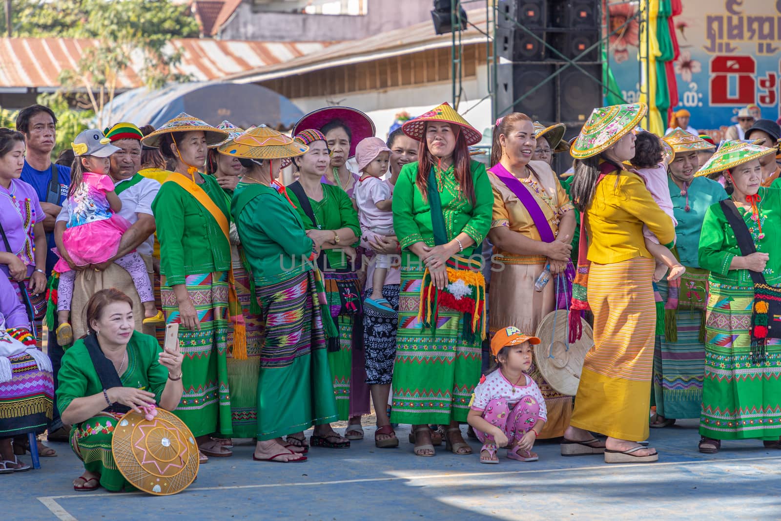 Group of Shan or Tai Yai (ethnic group living in parts of Myanmar and Thailand) in tribal dress do native dancing in Shan New Year celebrations. by phanthit