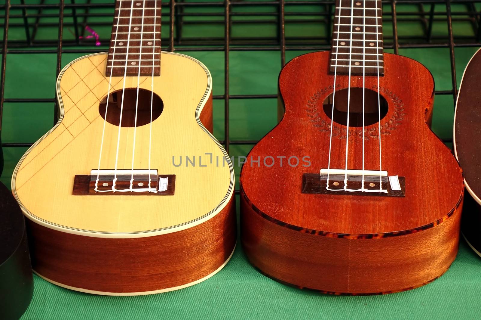 Ukuleles mini guitars on sale at an outdoor stall
