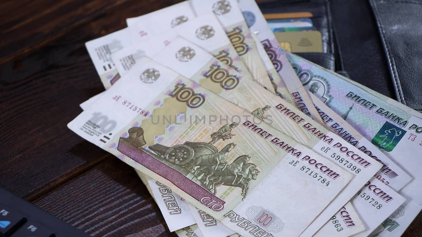 Lot with Russian rubles is on the wallet with credit cards.Paper banknotes Russian Rubles.Rubles is the national currency of Russia.bank of Russia.A thousand rubles close-up.Fall or rise of the ruble