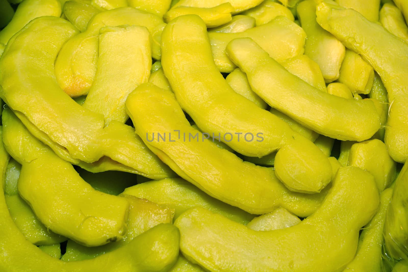 Heap of sweet pickled tamarind fruits for retail sale in Thailand food market. They are fruit preserves for long-term storage