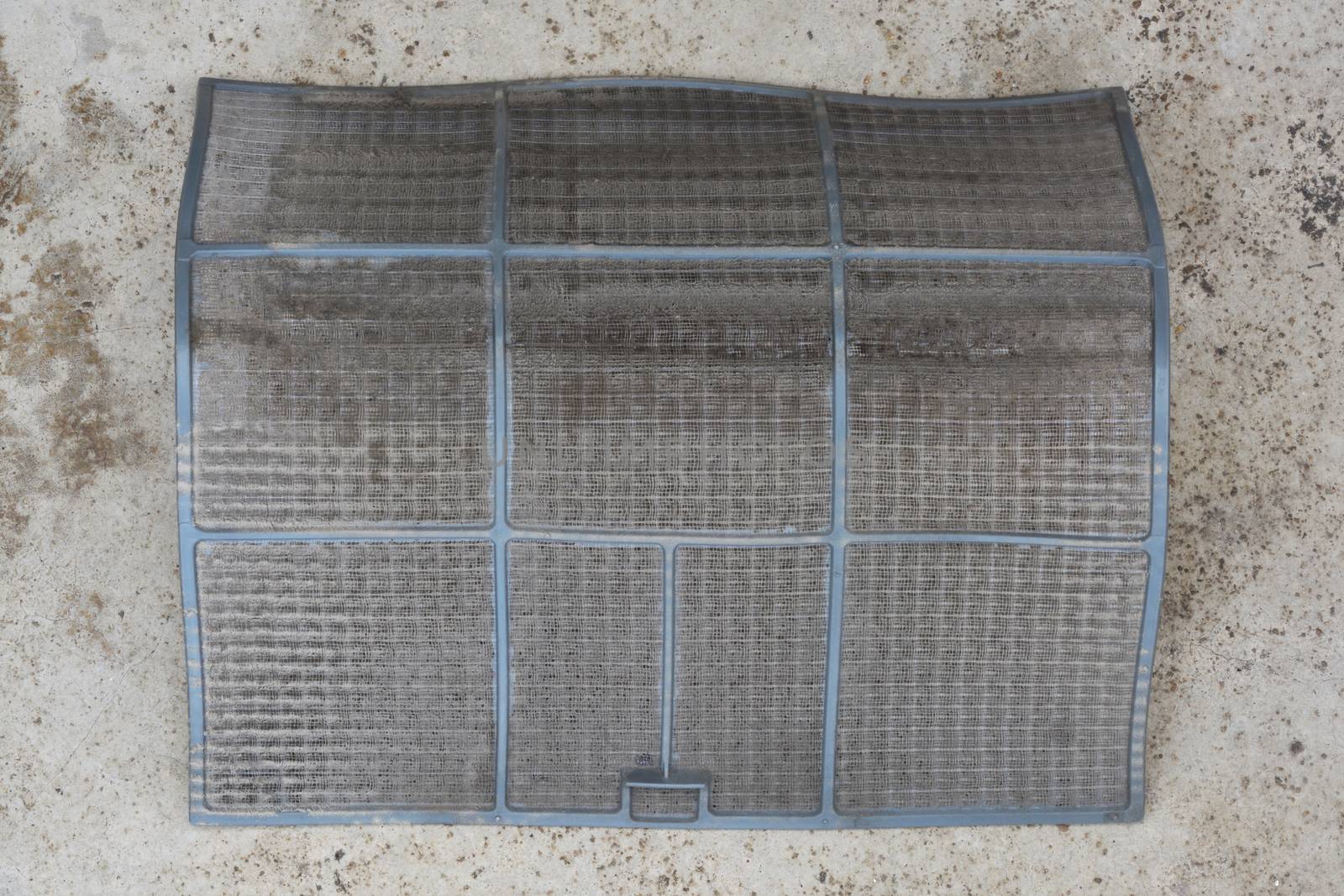 air conditioner filter on cement floor