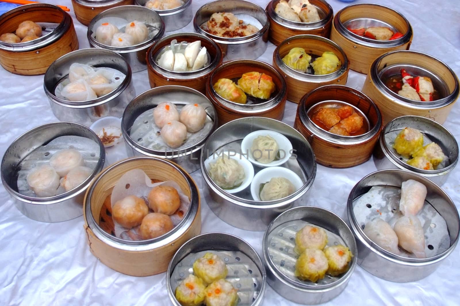 Chinese steamed dimsum in bamboo containers traditional cuisine	