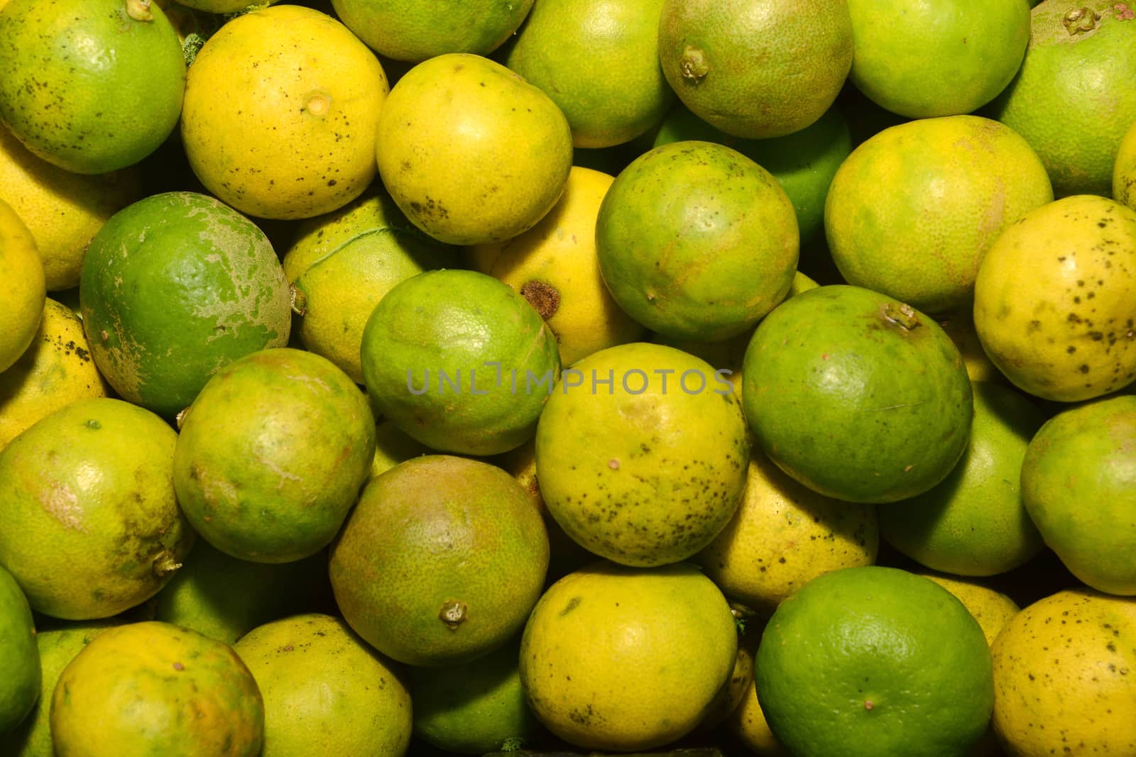 Stack of limes on display at market