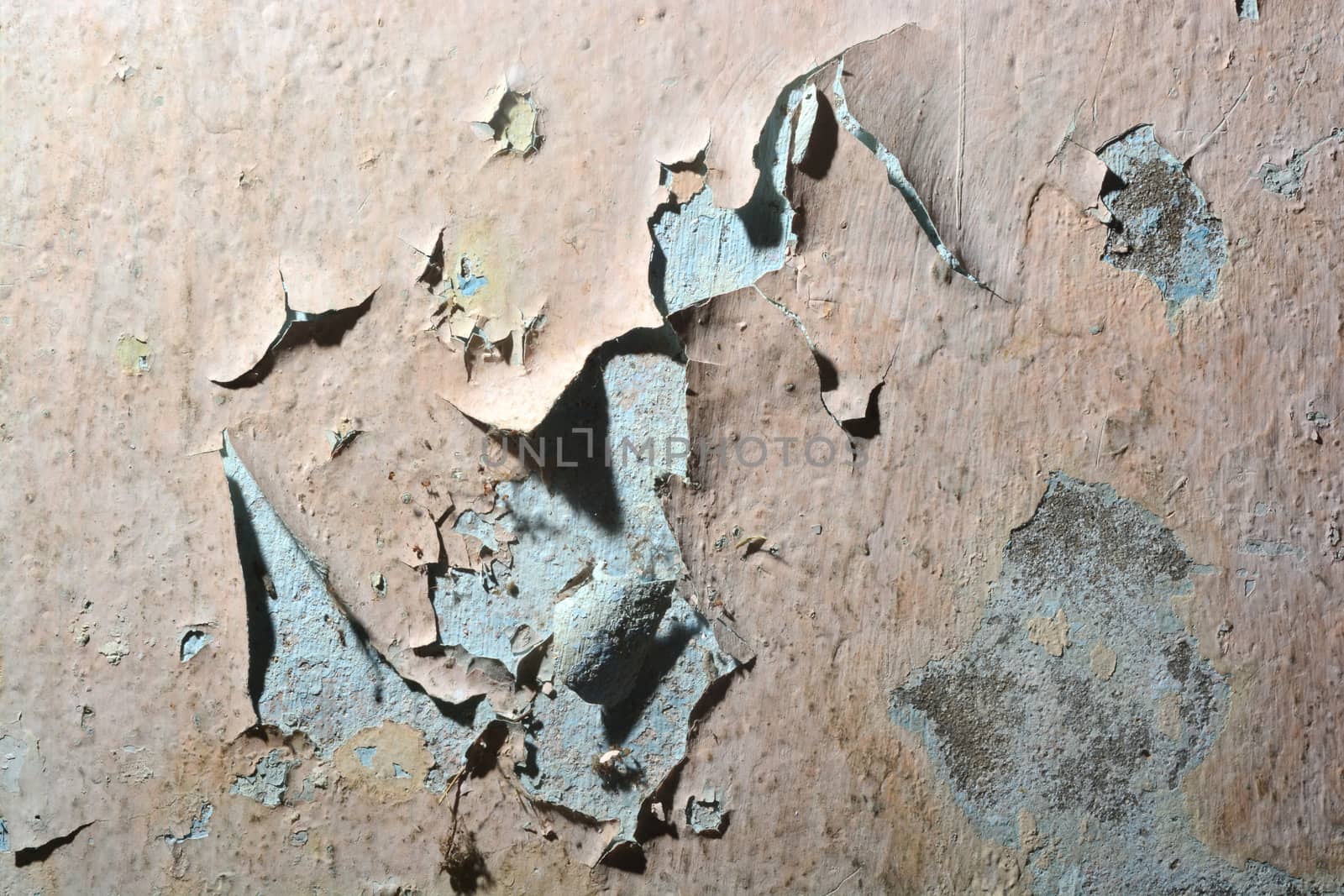 close up background and texture of peeling paint on pastering wall because moisture of water