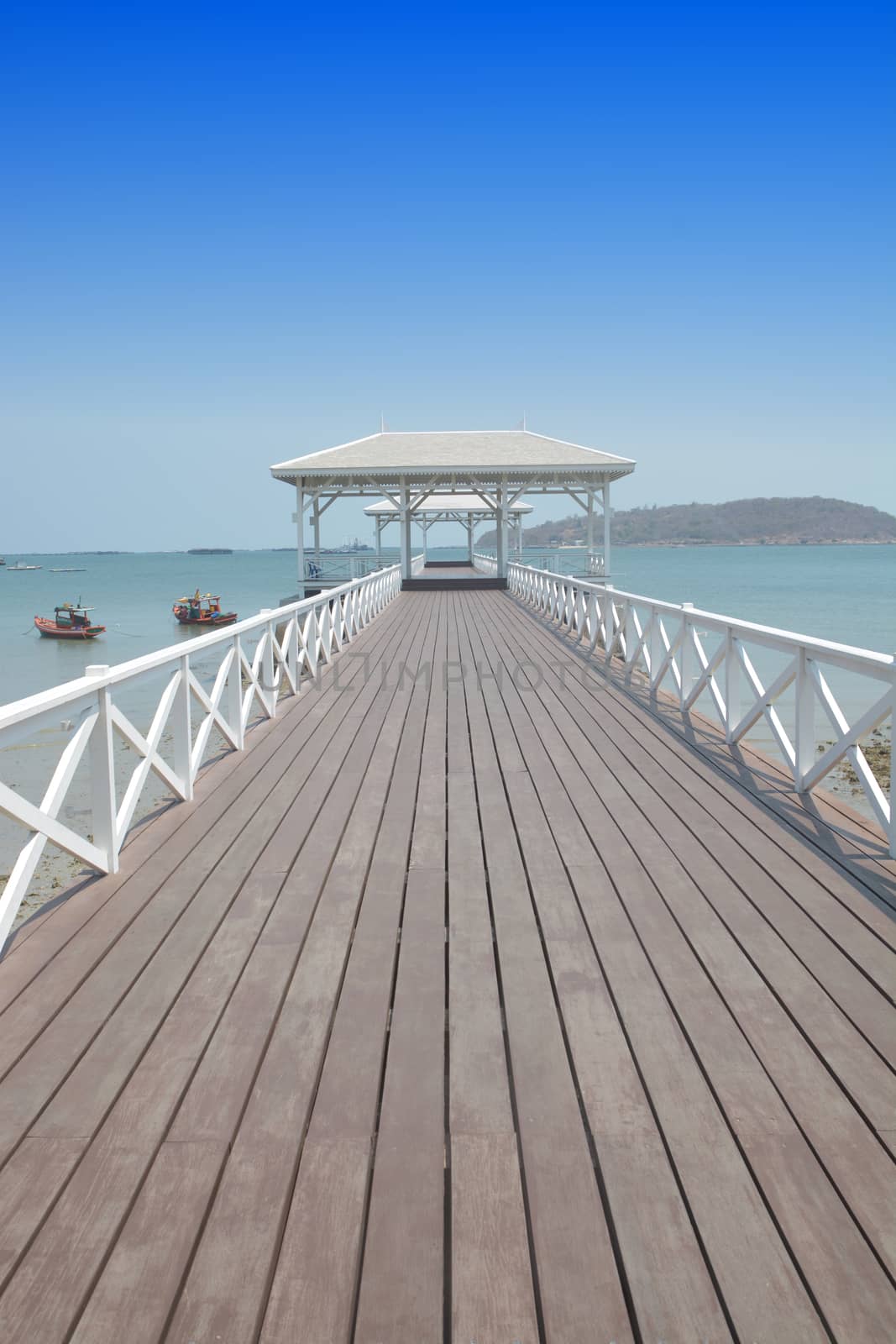 Beautiful white wooden bridge with blue sky, Sichang Island, Thailand