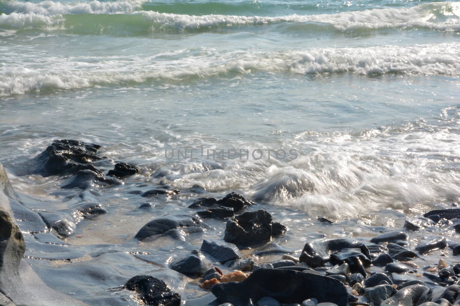 Rocky beach and surf by ideation90