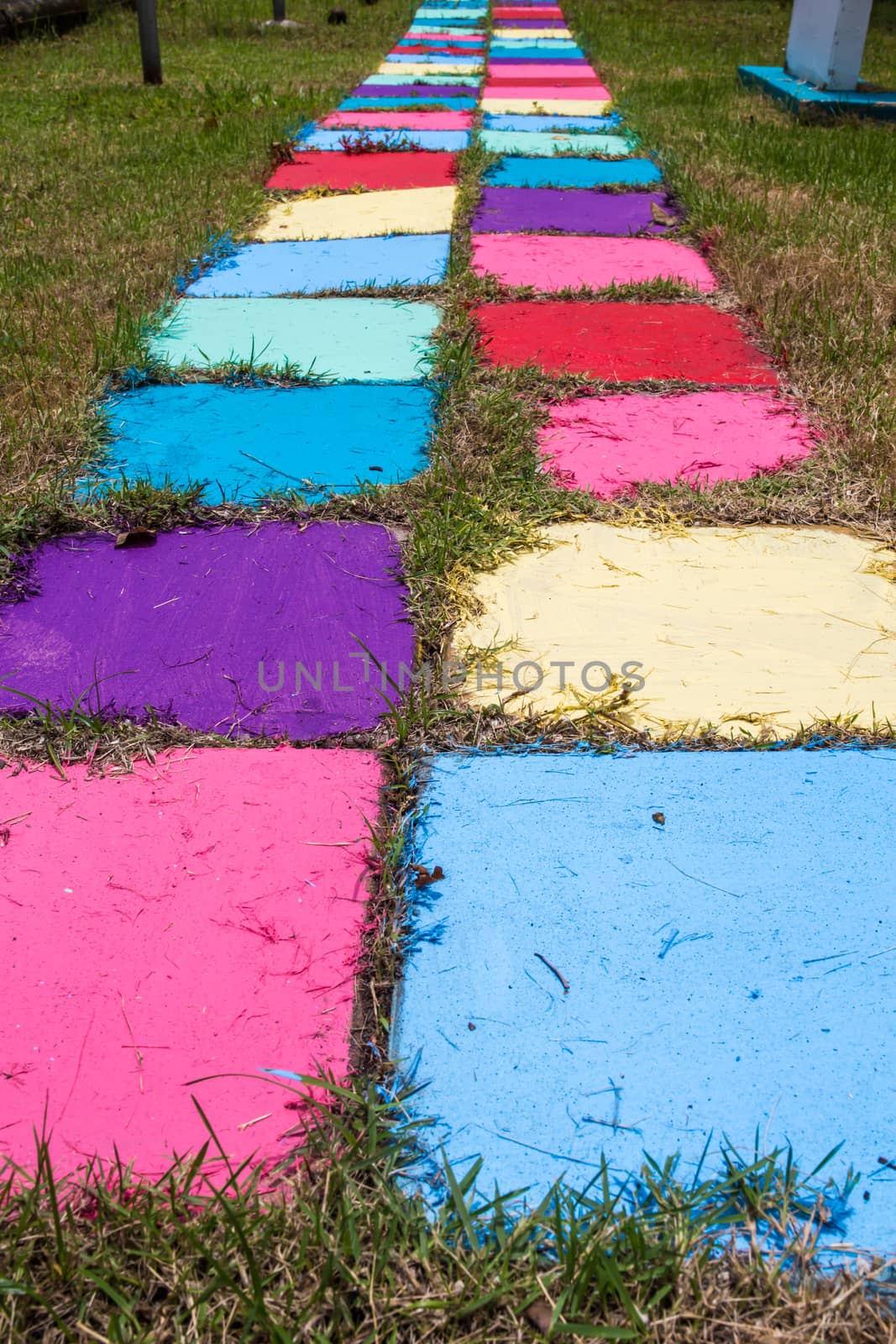 Many colored bricks were laid for walkways on the field.