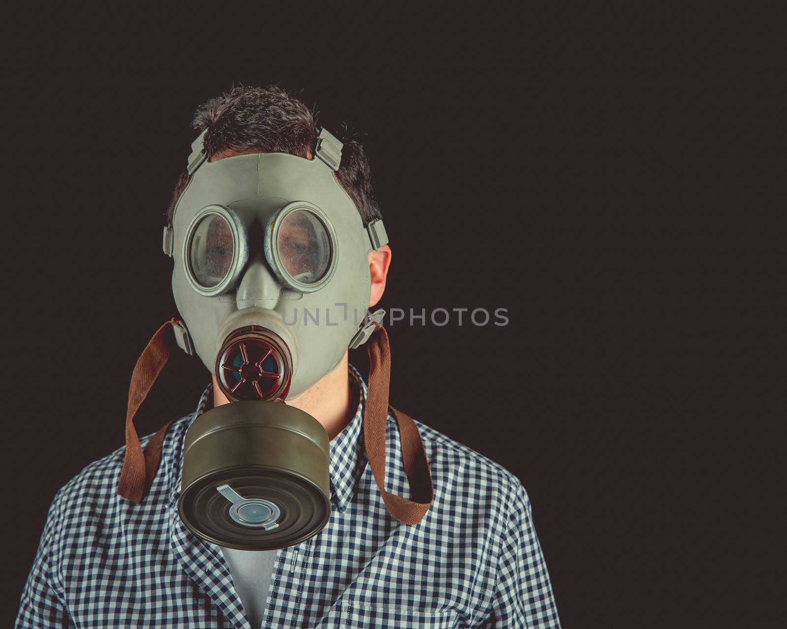 man in old military gas mask. copy space.