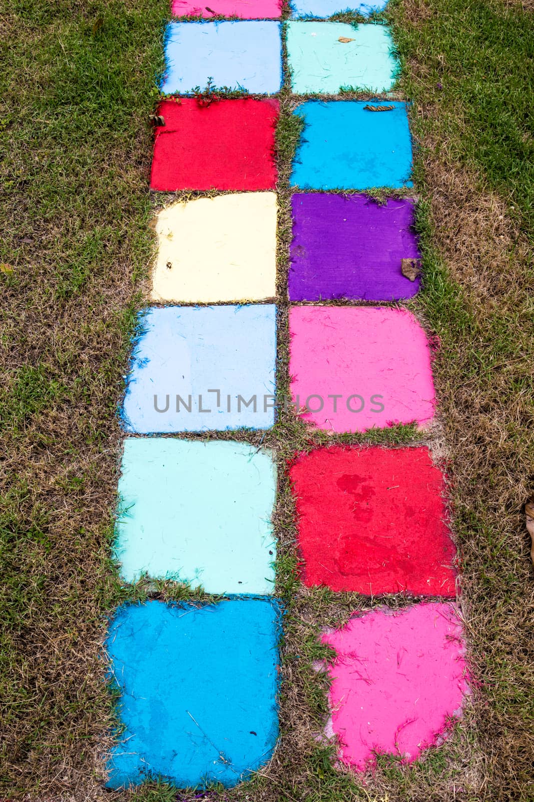 Many colored bricks were laid for walkways on the field.