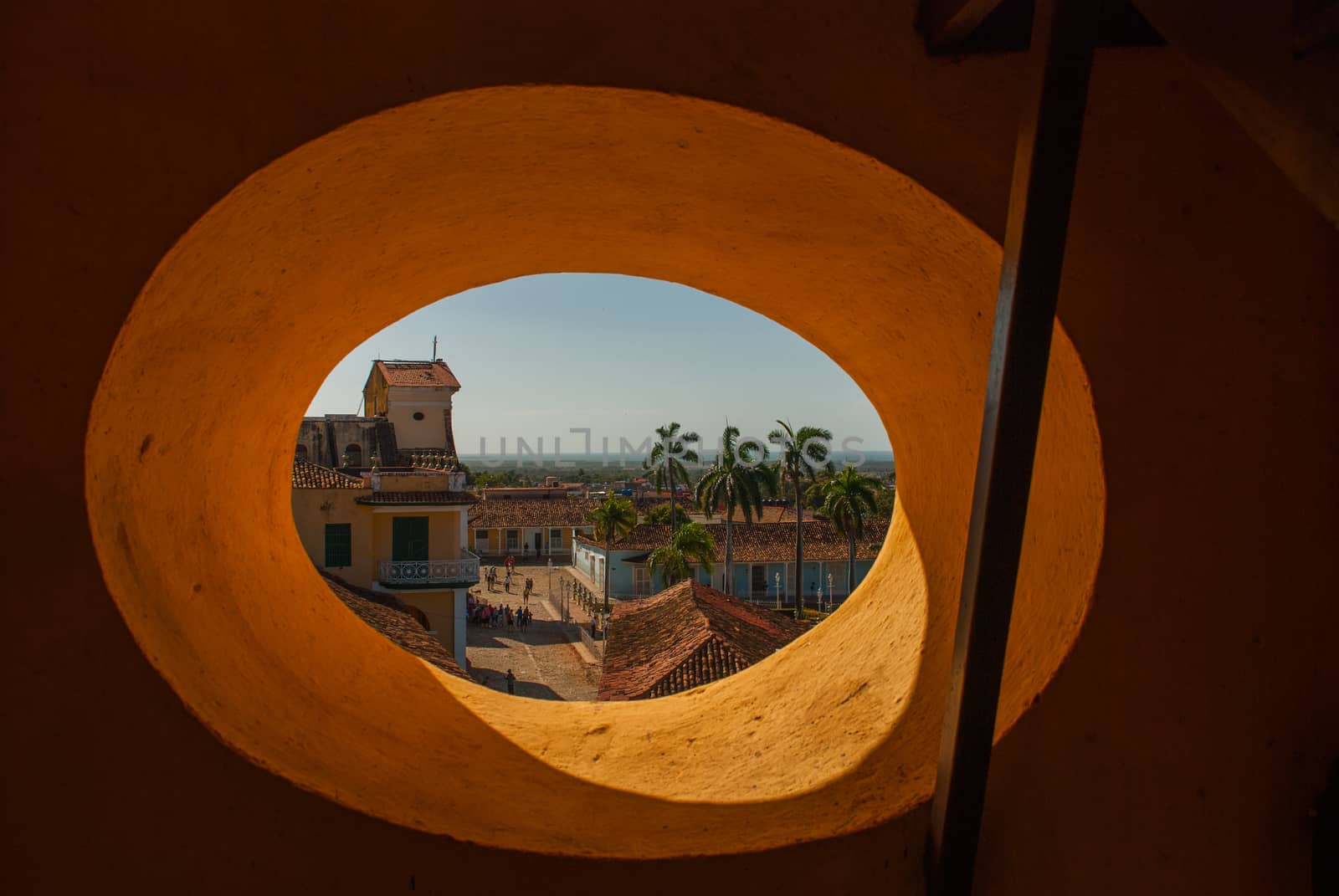 Top view of the Cuban city from a circular window. Trinidad on Cuba. Plaza mayor and Church of the Holy Trinity.