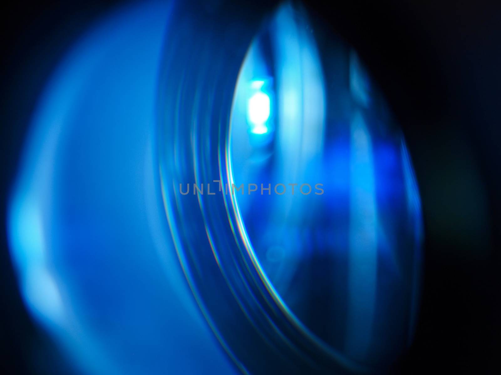 Led projector lens close up with soft focus. Blue lights.