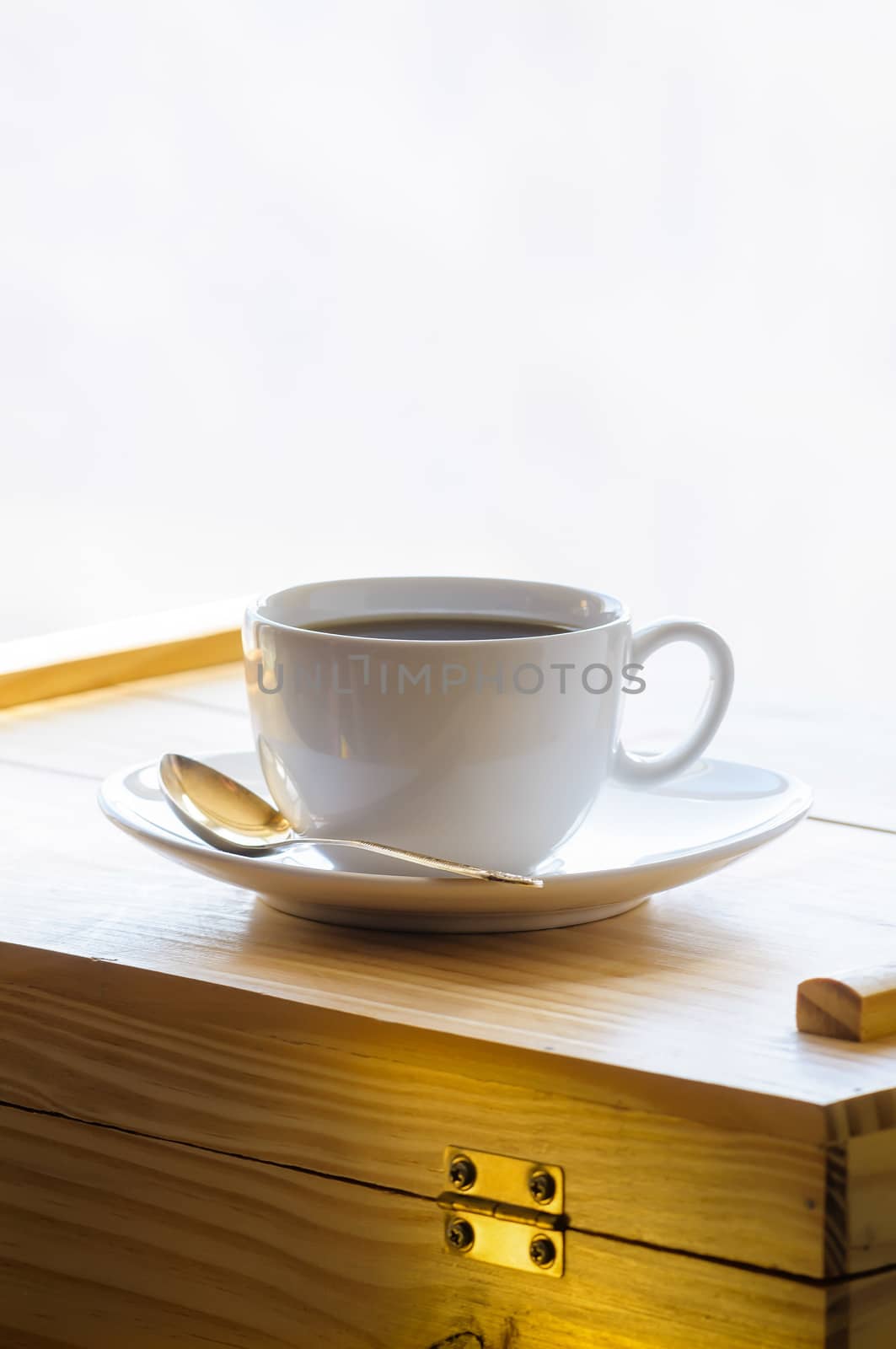 Time for a break. The worker drinks a cup of warm and flavoured coffee