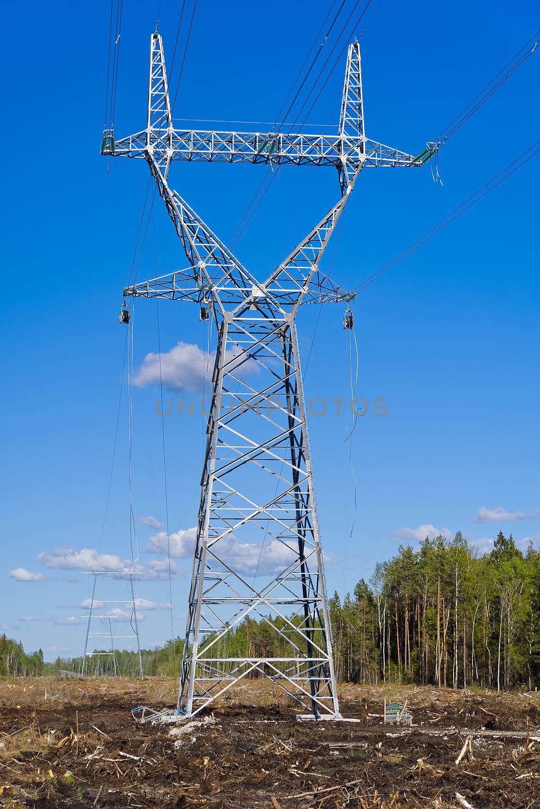 construction of new high voltage lines in forest. Estonia. new mast of a high voltage power line. installation of a high voltage power line