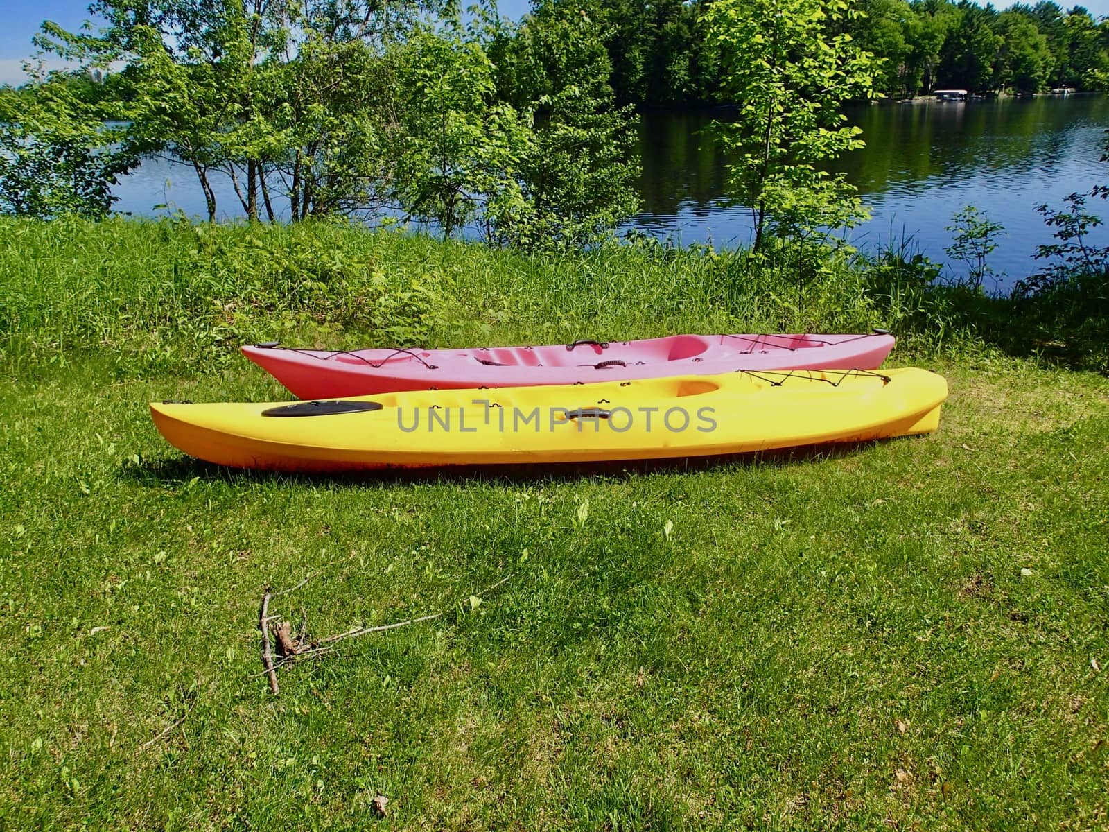 Two Kyaks on the shore of a freshwater lake