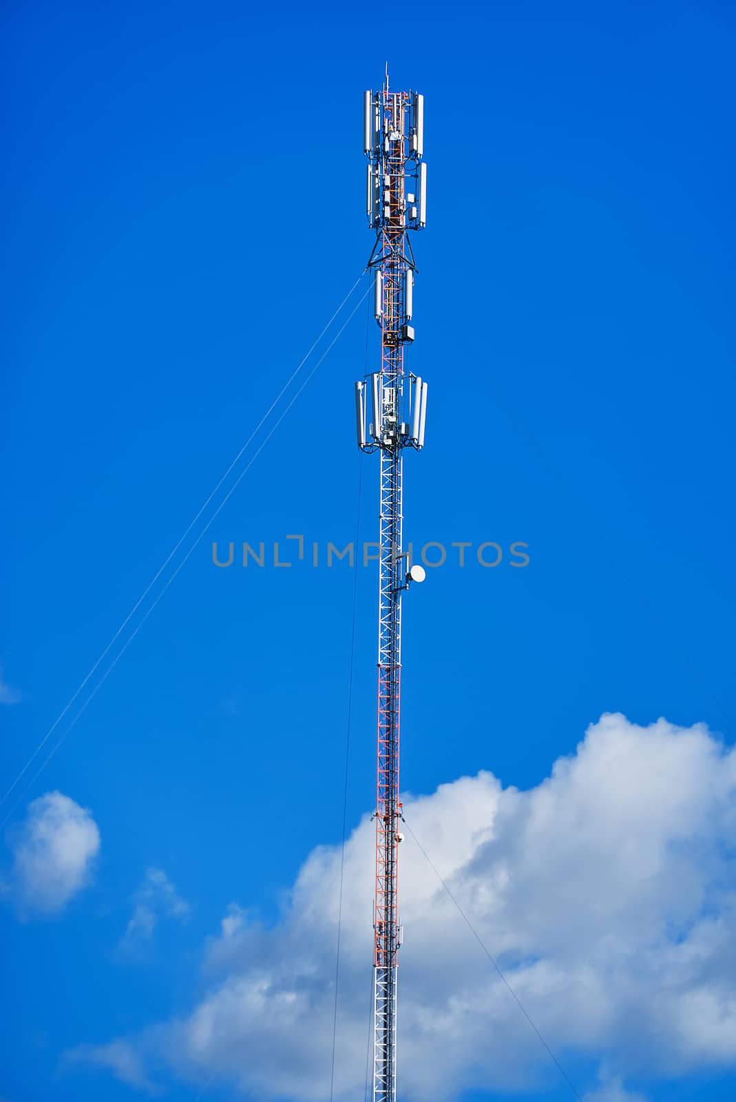 Telecommunication tower of 4G and 5G cellular. Cell Site Base Station. Wireless Communication Antenna Transmitter. Telecommunication tower with antennas against blue sky background
