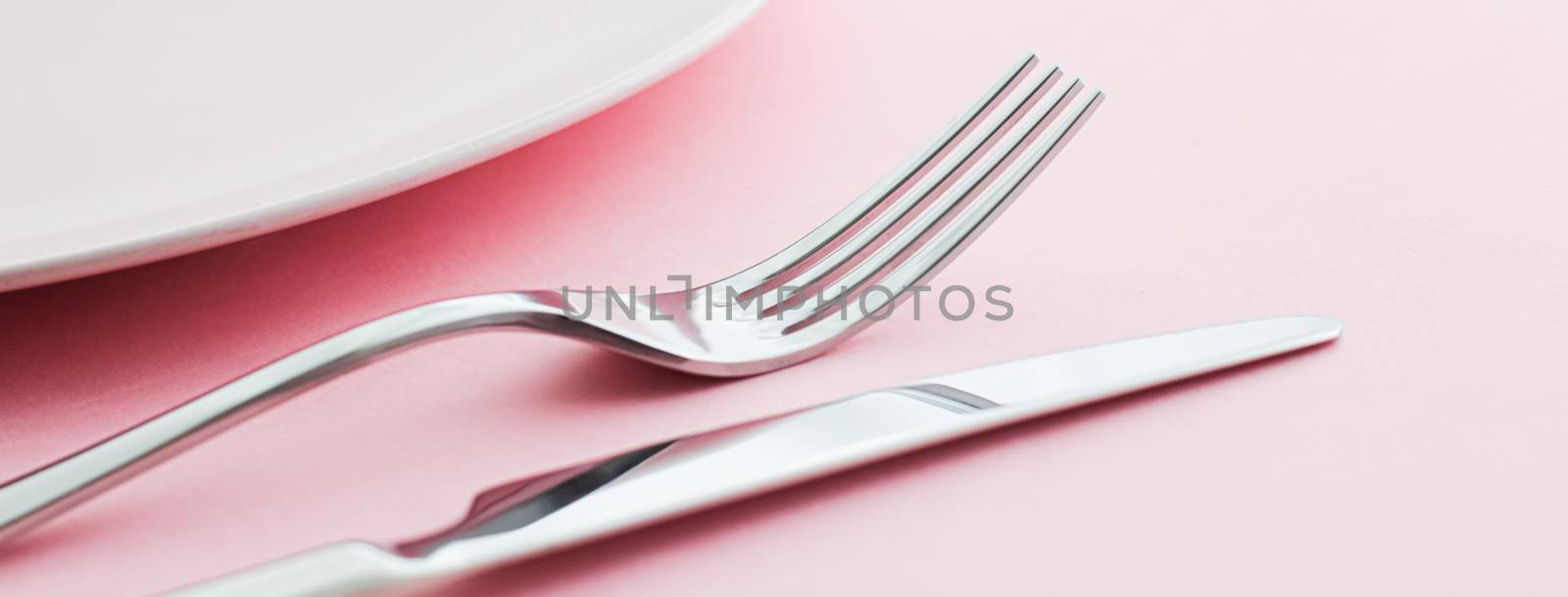 Empty plate and cutlery as mockup set on pink background, top tableware for chef table decor and menu branding by Anneleven