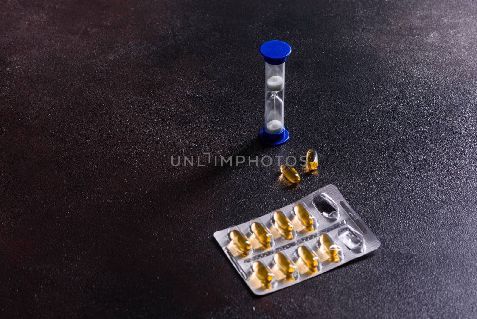 Omega 3 capsules on black dark background. Dietary supplements