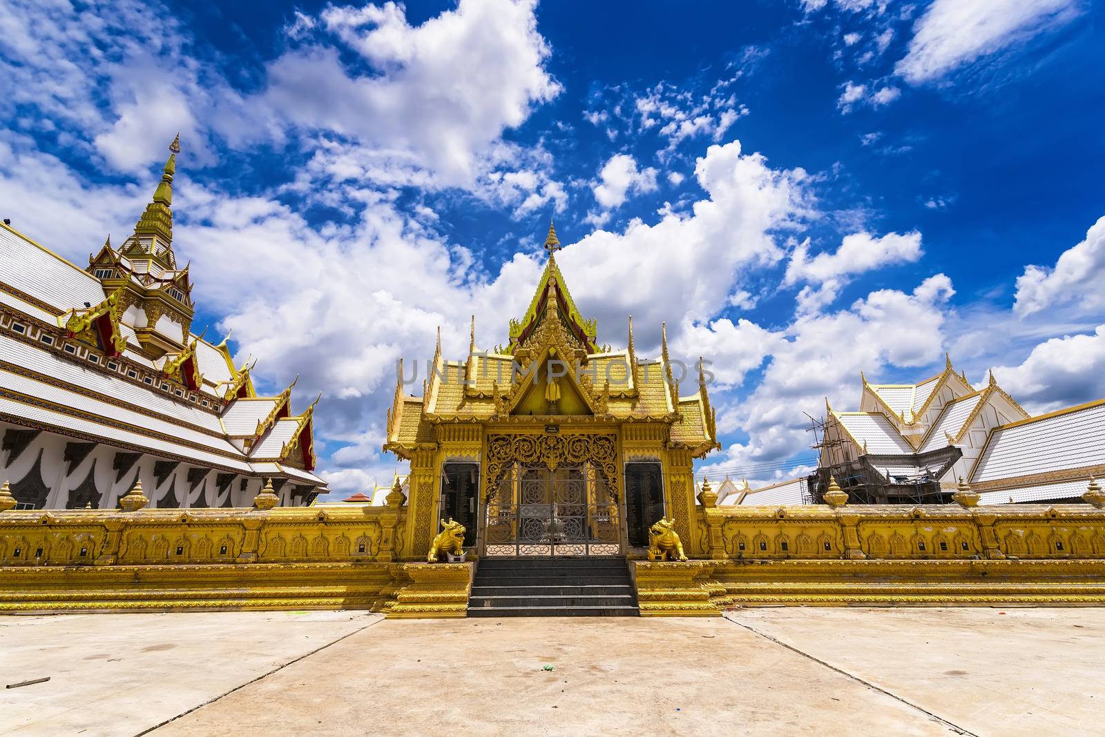 Nakhon Pathom, Thailand - June, 09, 2020 : The golden church of Chareon Rat Bamrung Temple (Nong Phong Nok Temple) the place of faith in Nakhon Pathom,Thailand