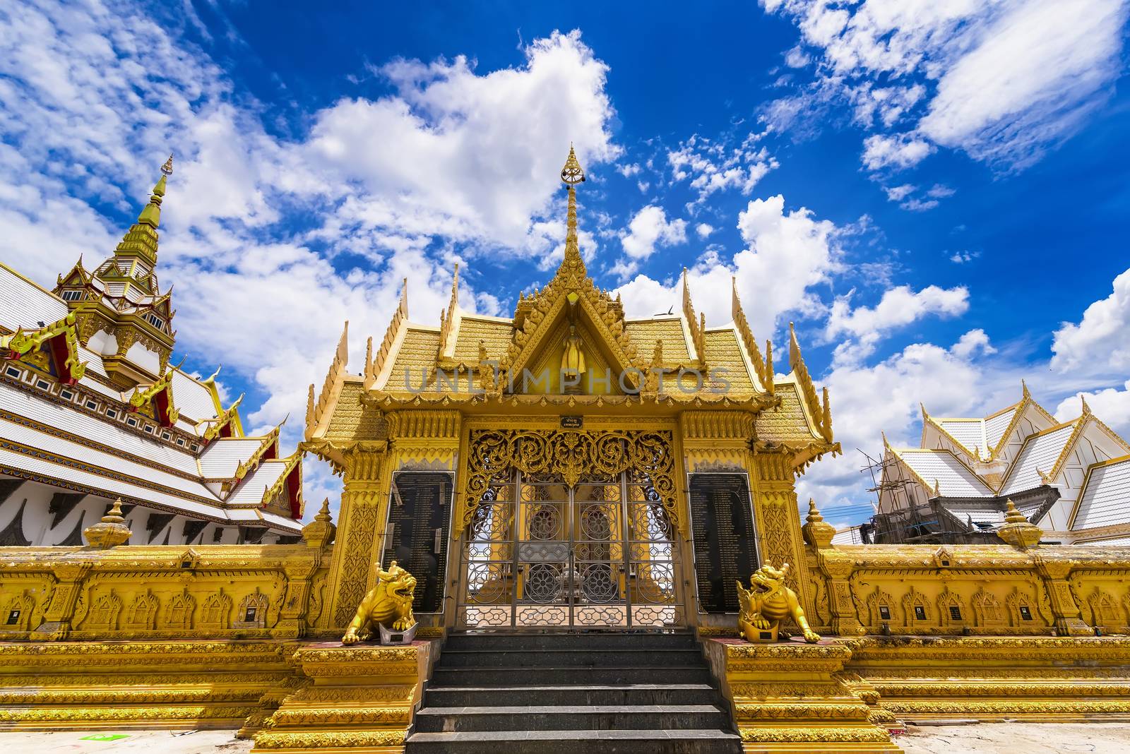 Nakhon Pathom, Thailand - June, 09, 2020 : The golden church of Chareon Rat Bamrung Temple (Nong Phong Nok Temple) the place of faith in Nakhon Pathom,Thailand