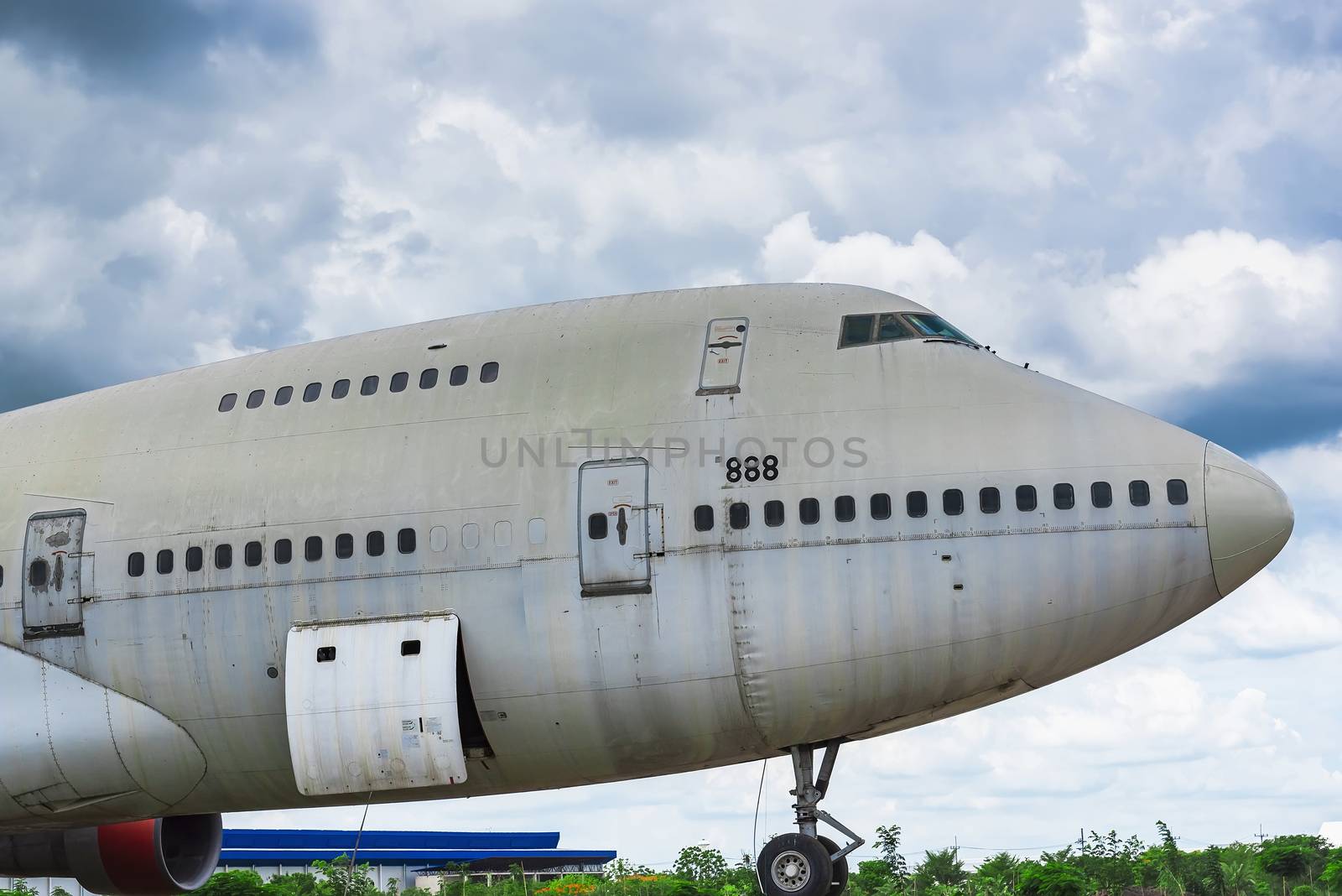 Nakhon Pathom, Thailand - June, 09, 2020 : The old commercial aircraft was discharged with a stormy sky at Nakhon Pathom, Thailand