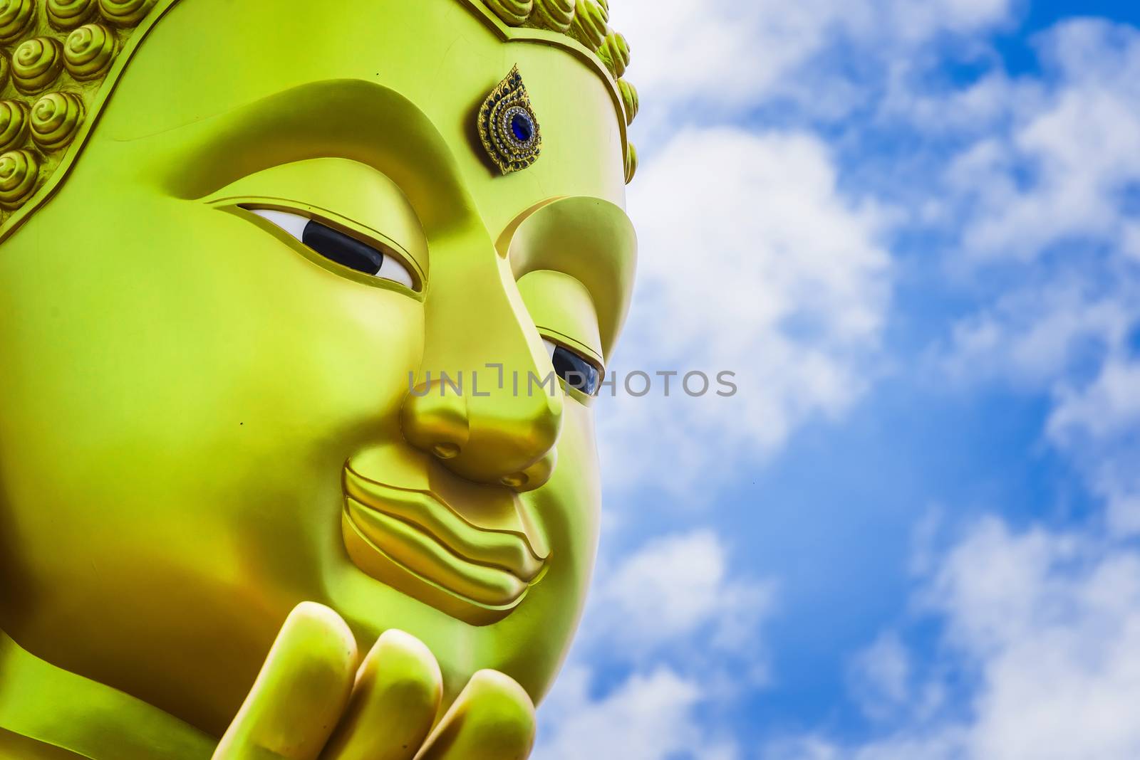 The face of Big Goldden Buddha statue of Chareon Rat Bamrung Tem by Bubbers