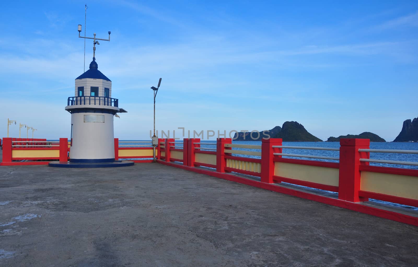 White lighthouse With sea and islands in the background