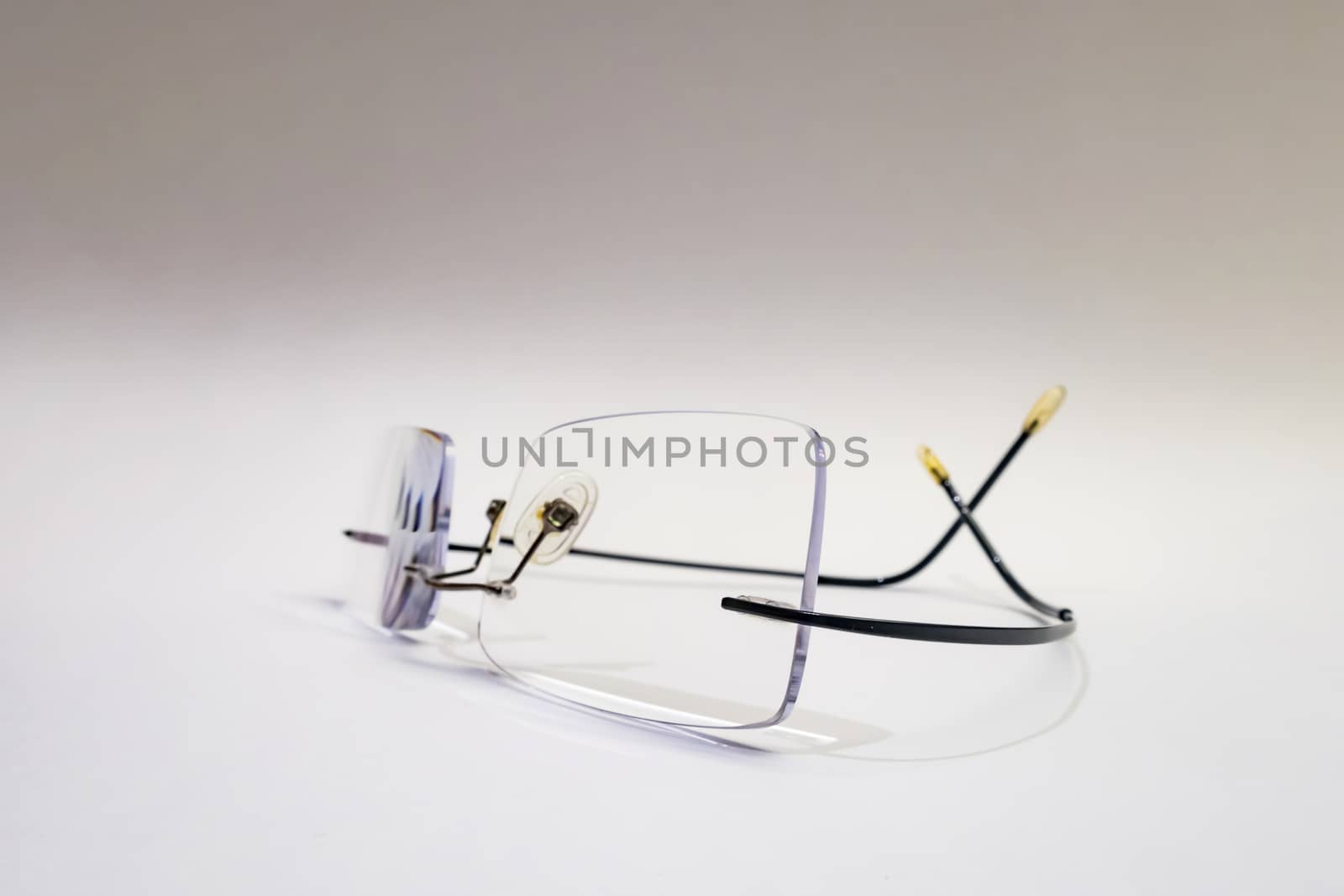close up eyeglasses on white background by yilmazsavaskandag