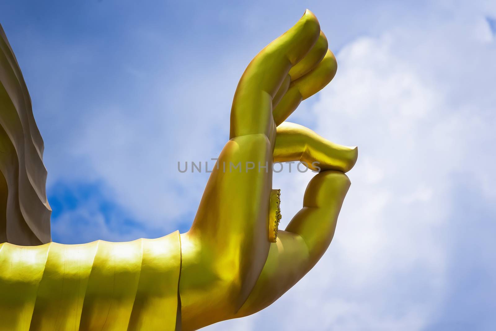 The hand of Big Goldden Buddha statue of Chareon Rat Bamrung Temple (Nong Phong Nok Temple) the place of faith in Thailand