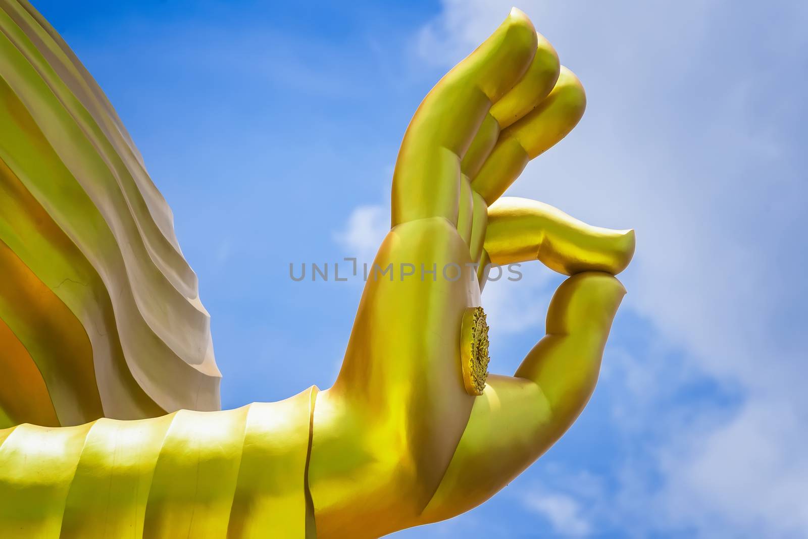 The hand of Big Goldden Buddha statue of Chareon Rat Bamrung Temple (Nong Phong Nok Temple) the place of faith in Thailand