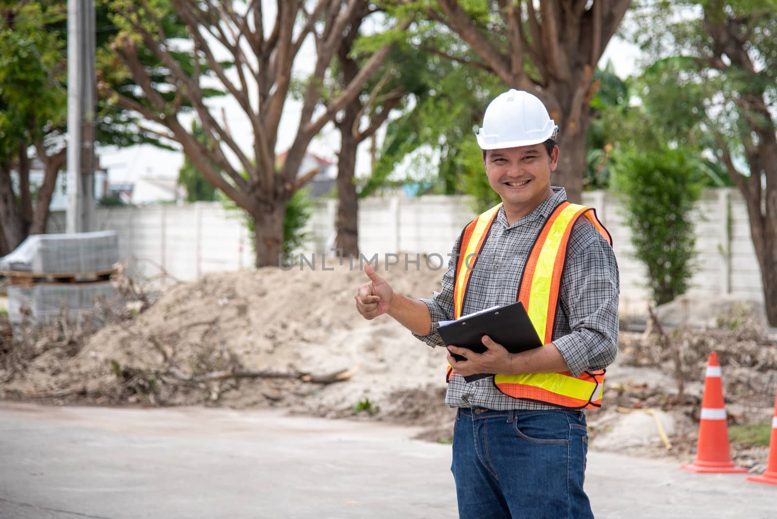 Man construction engineer at construction site by PongMoji