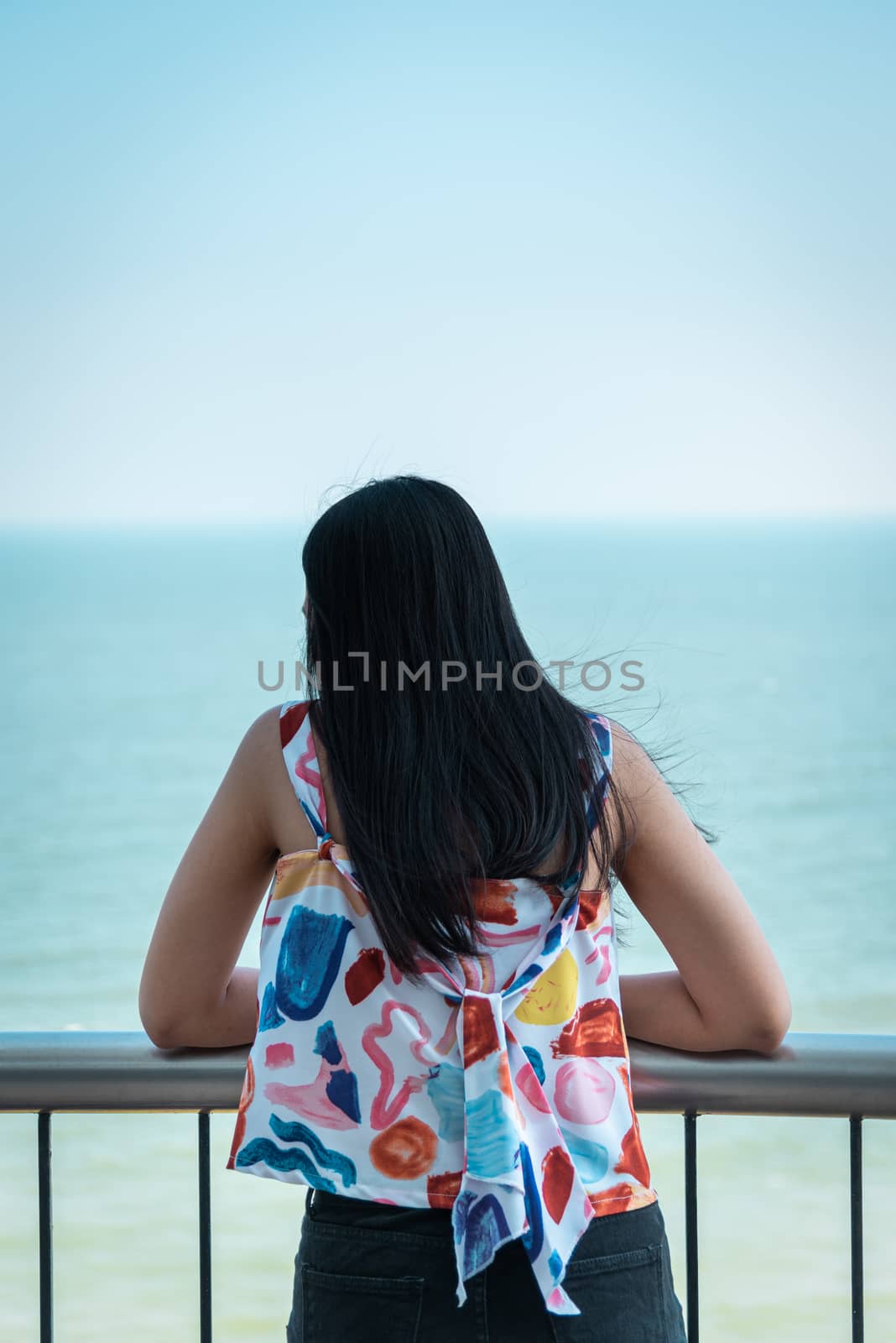 Woman relax at sea viewpoint in concept travel by PongMoji