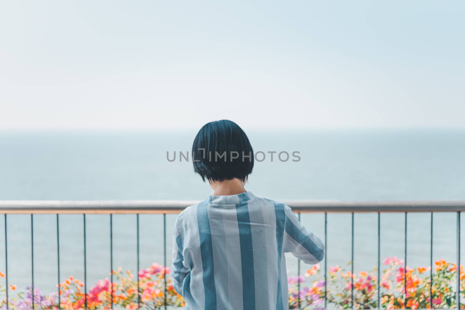 Woman relax at sea viewpoint in concept travel by PongMoji