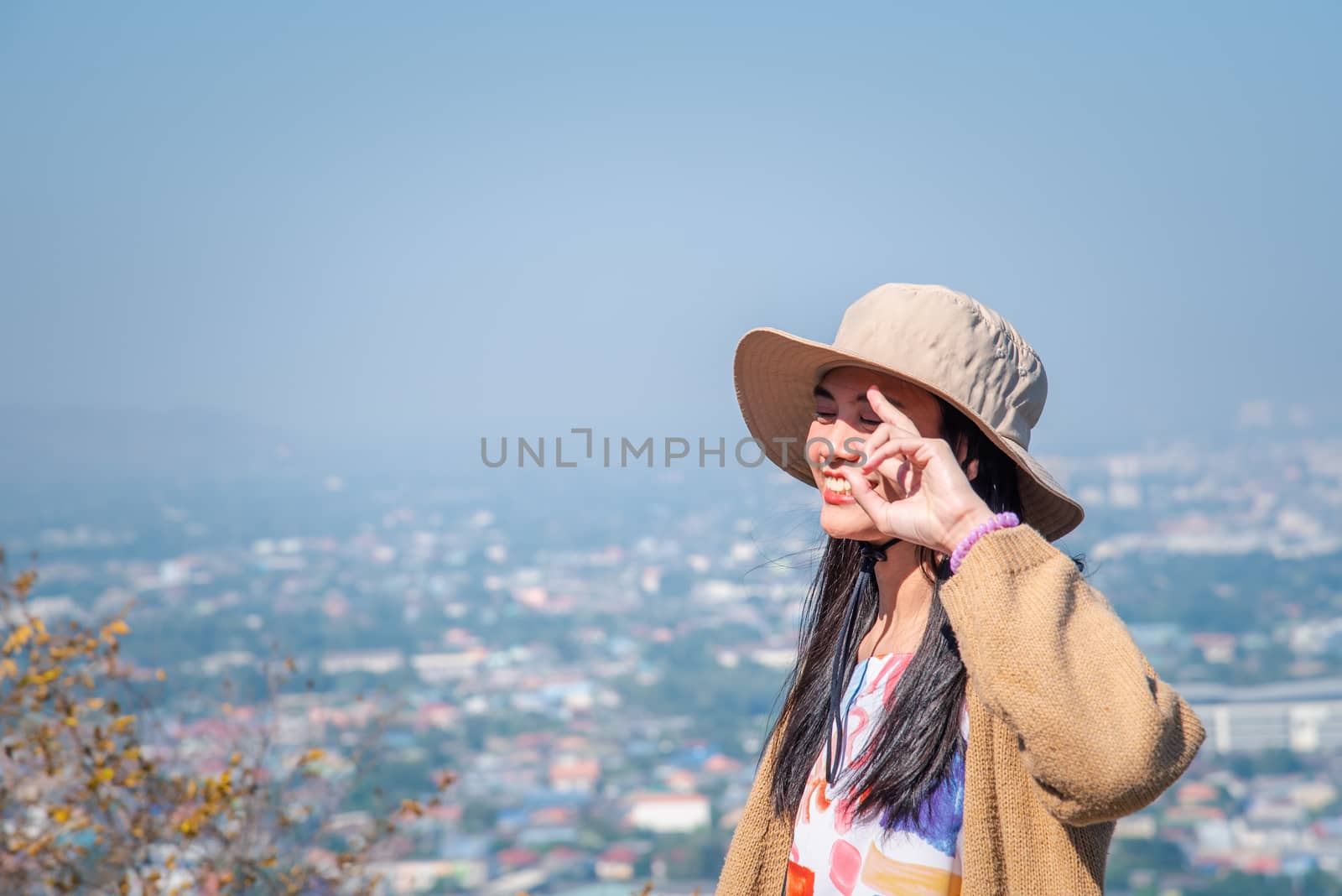 Woman relax at landscape viewpoint on mountain by PongMoji