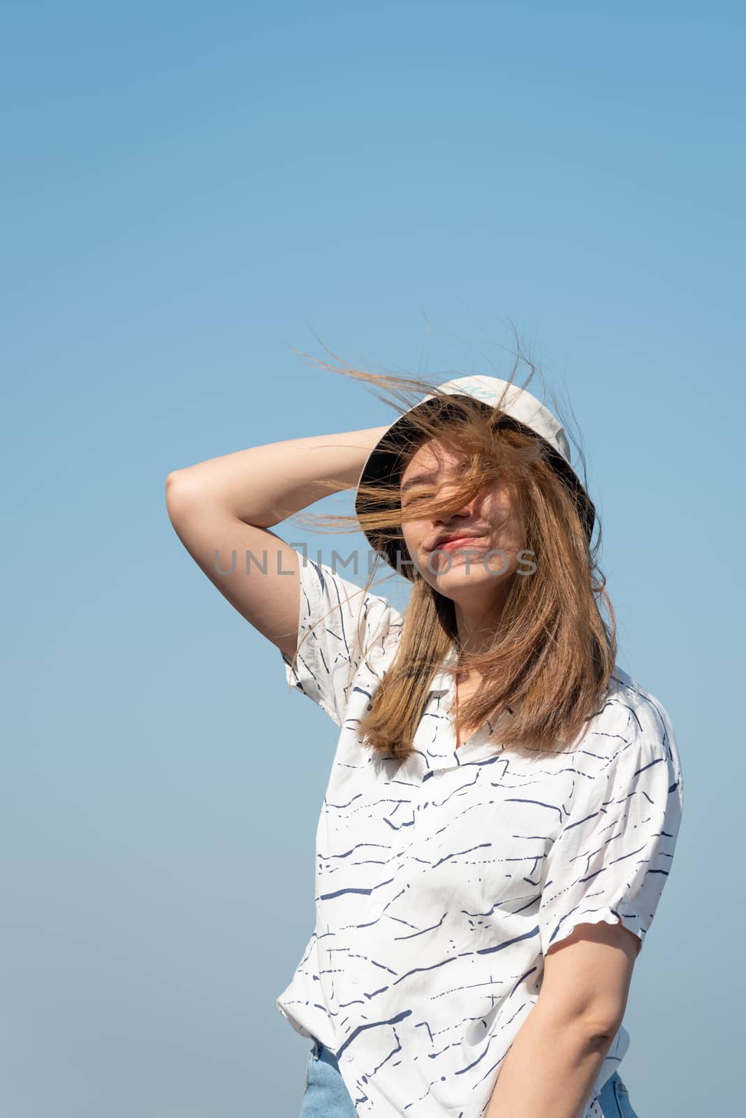 Woman relax at sea viewpoint in concept travel by PongMoji