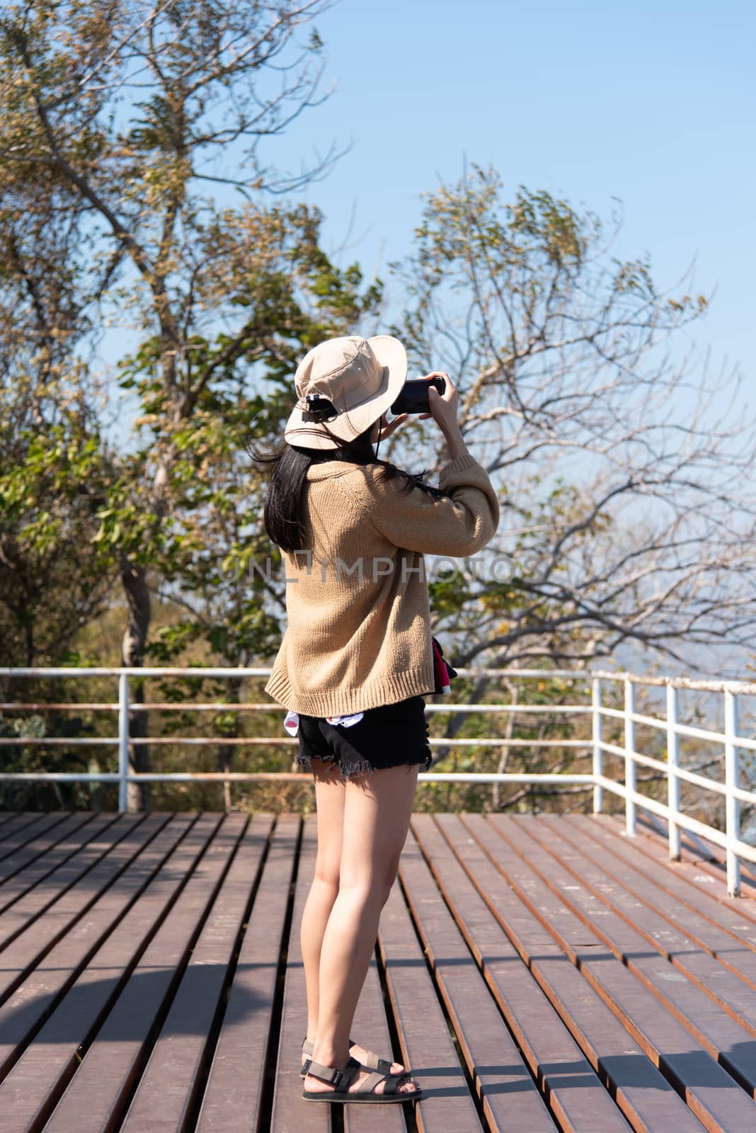 Woman relax at landscape viewpoint on mountain by PongMoji